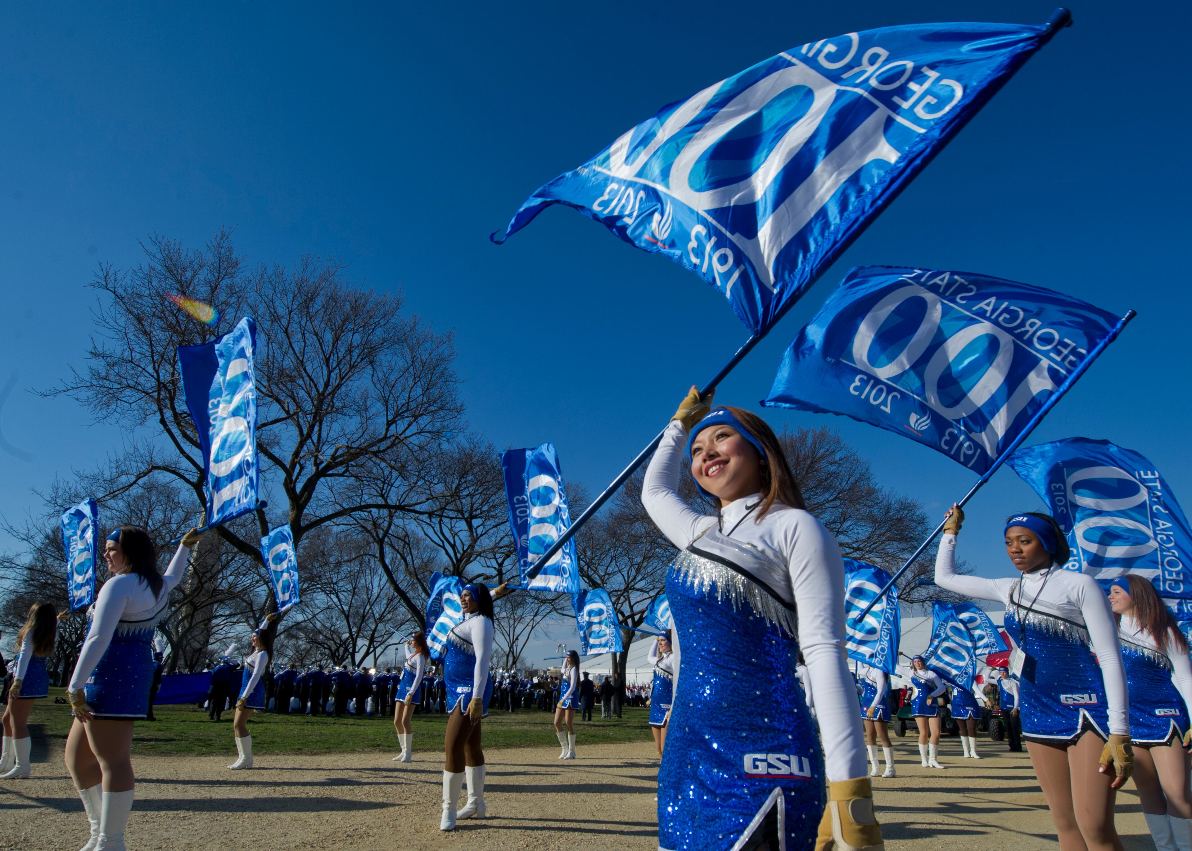 Sandy Kiamco of GSU Marching Band Color Guard practices before the Inaugural Parade.