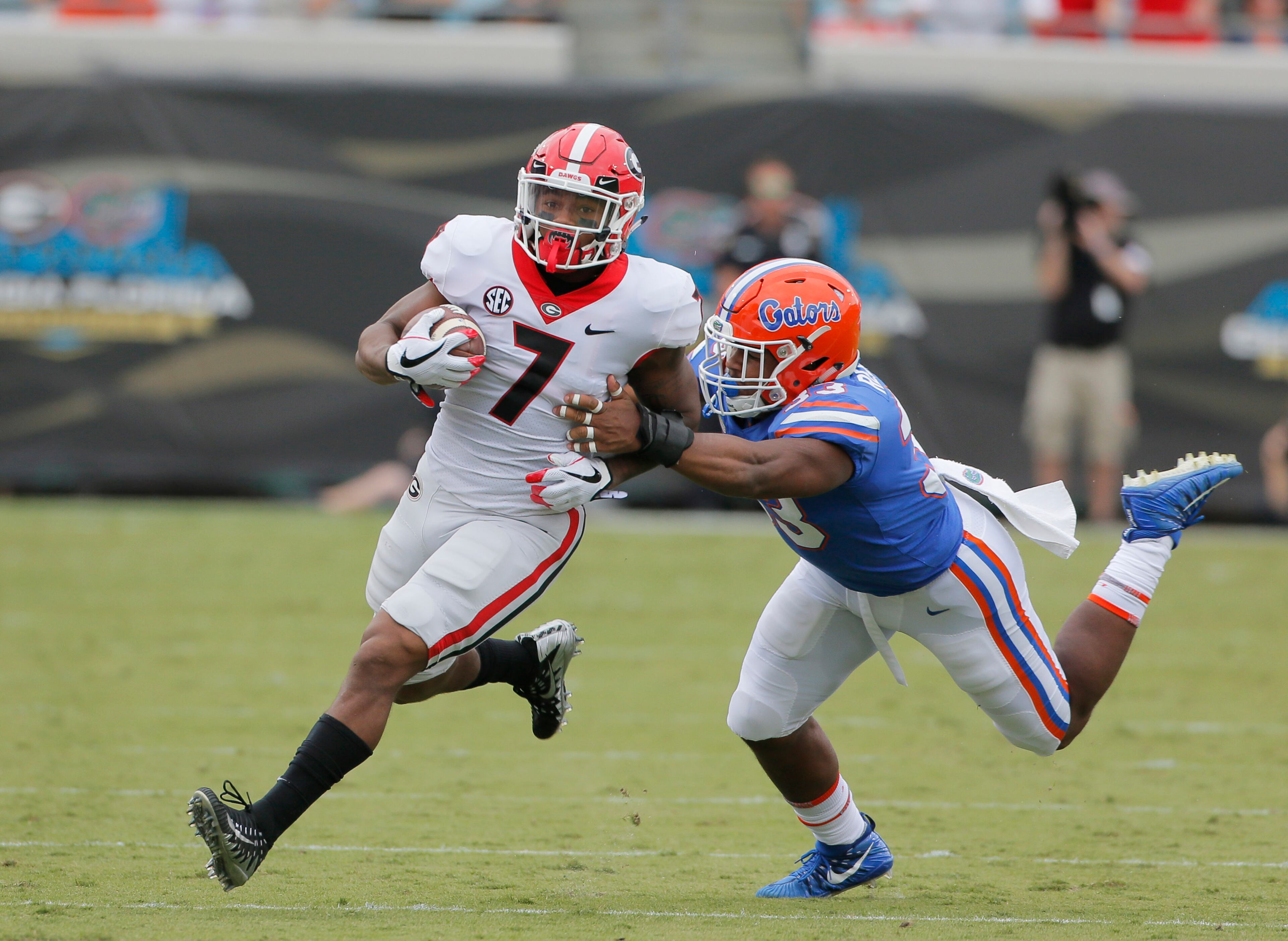 10/28/17 - Jacksonville, FL - Georgia Bulldogs running back D'Andre Swift (7) breaks free on a long run on Georgia's first possession to set up their first TD. NCAA football game between Georgia and Florida at EverBank Field in Jacksonville. BOB ANDRES /BANDRES@AJC.COM