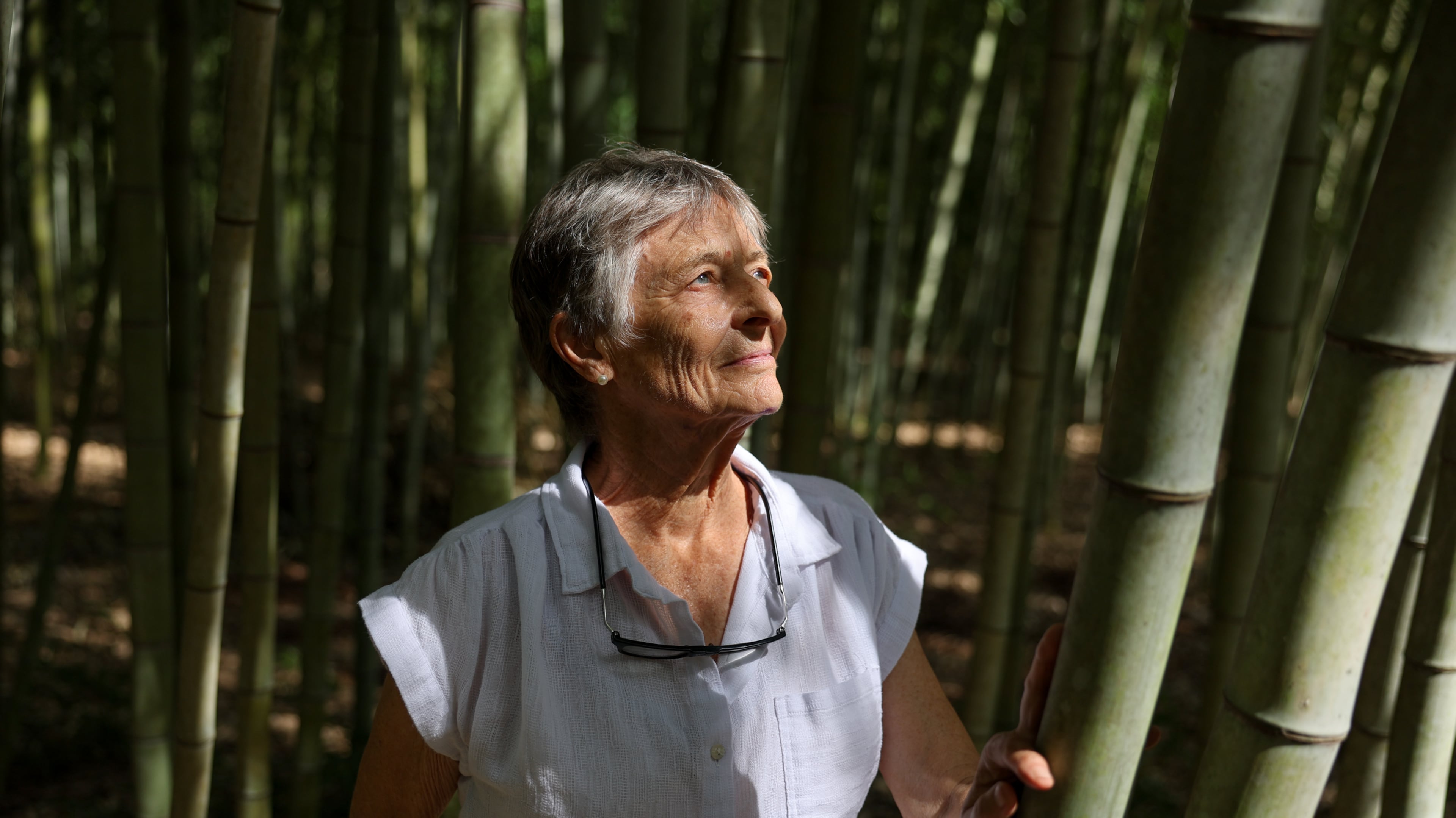Daphne Lewis poses at her bamboo farm in Hawkinsville on Sept. 16, 2026. Bamboo, she says, is "a total ecological miracle." (Arvin Temkar/AJC)