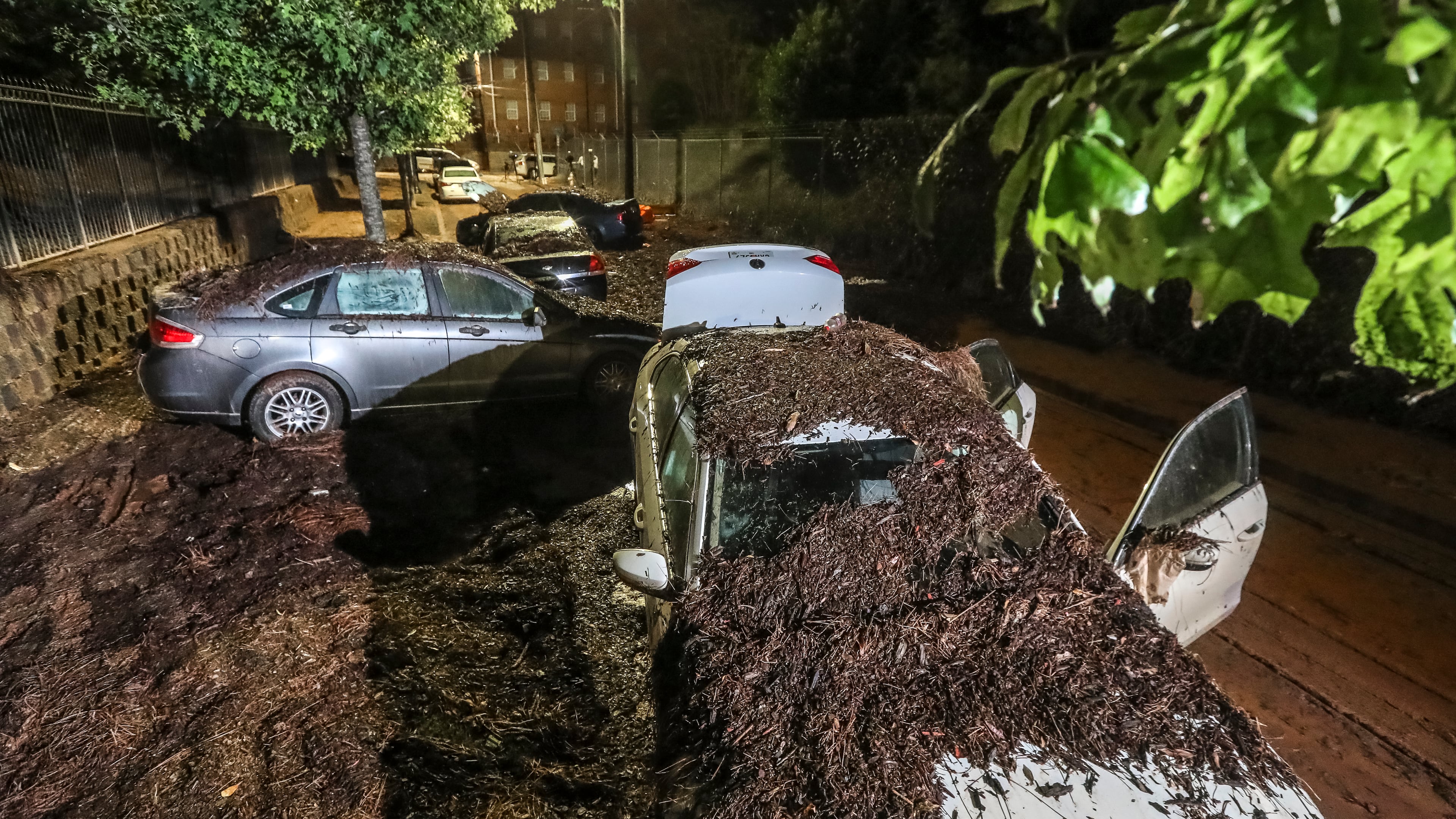 At Clark Atlanta University, so much mud was left behind from a fierce rainstorm on Sept. 14 that it looked like a dirt road as flooded cars remained after the water receded the following morning. According to city officials, rain gauges show that about three hours’ worth of rain came down in just 15 minutes in some areas of downtown Atlanta, flooding many areas including the campus. (John Spink / John.Spink@ajc.com)