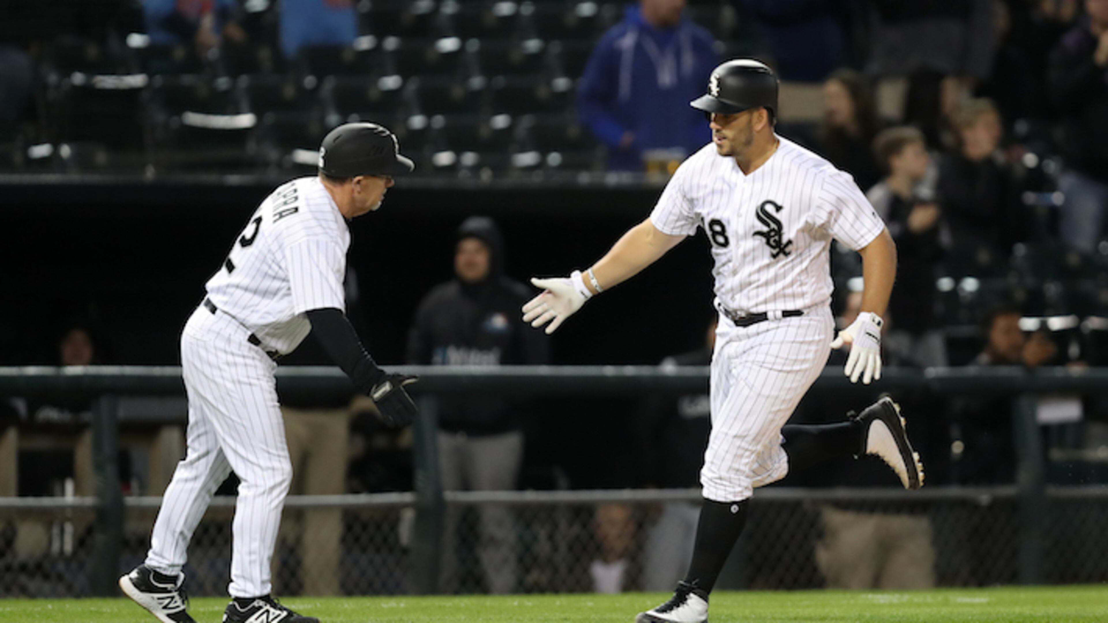 The Chicago White Sox' Daniel Palka (18) is congratulated by third base coach Nick Capra after Palka hit a two-run home run against the Minnesota Twins at Guaranteed Rate Field in Chicago on May 3, 2018. (Chris Sweda/Chicago Tribune/TNS)