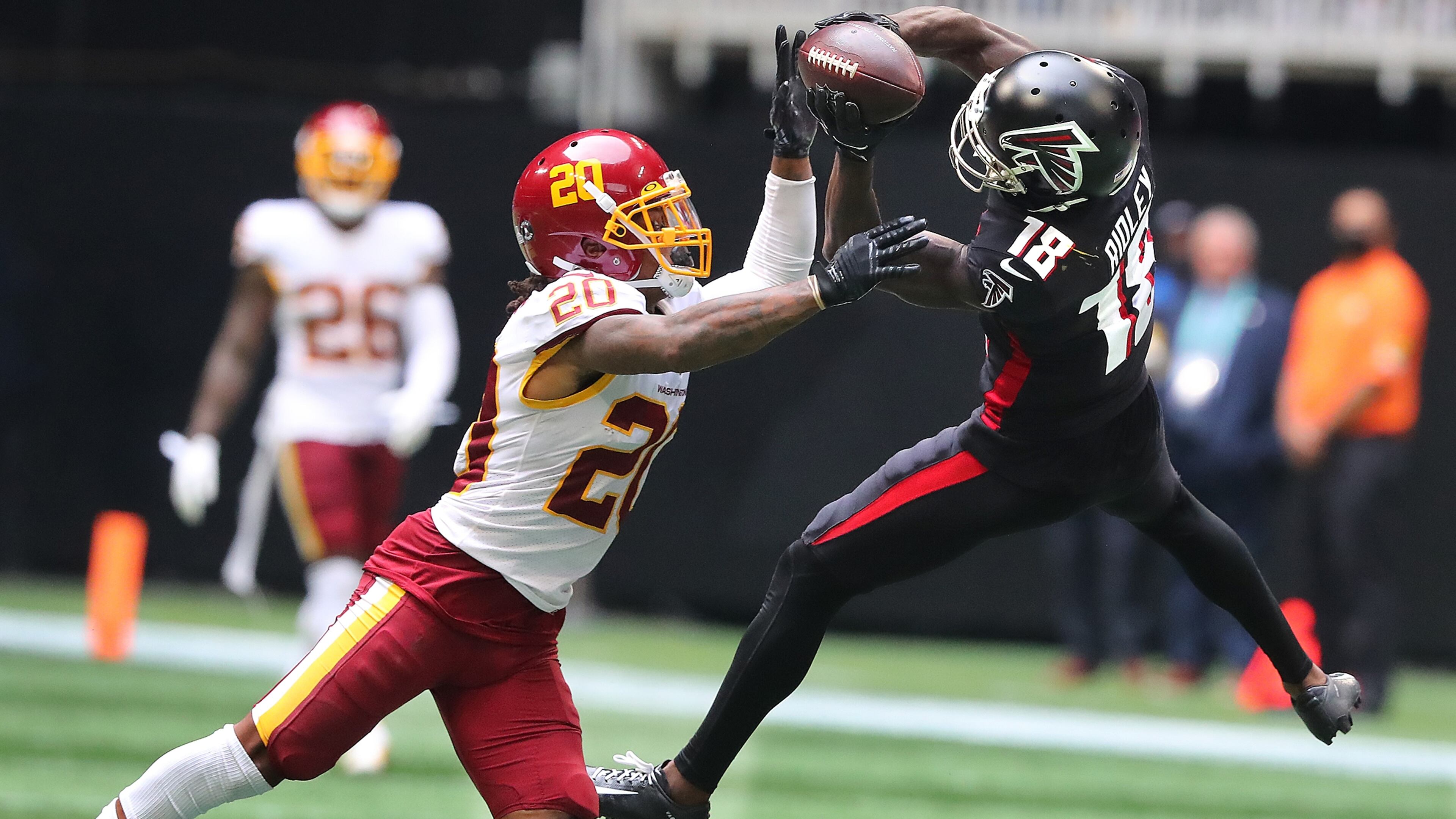 Washington Football Team safety Bobby McCain breaks up a pass to Falcons wide receiver Calvin Ridley during the fourth quarter Sunday, Oct. 3, 2021, at Mercedes-Benz Stadium in Atlanta. (Curtis Compton / Curtis.Compton@ajc.com)