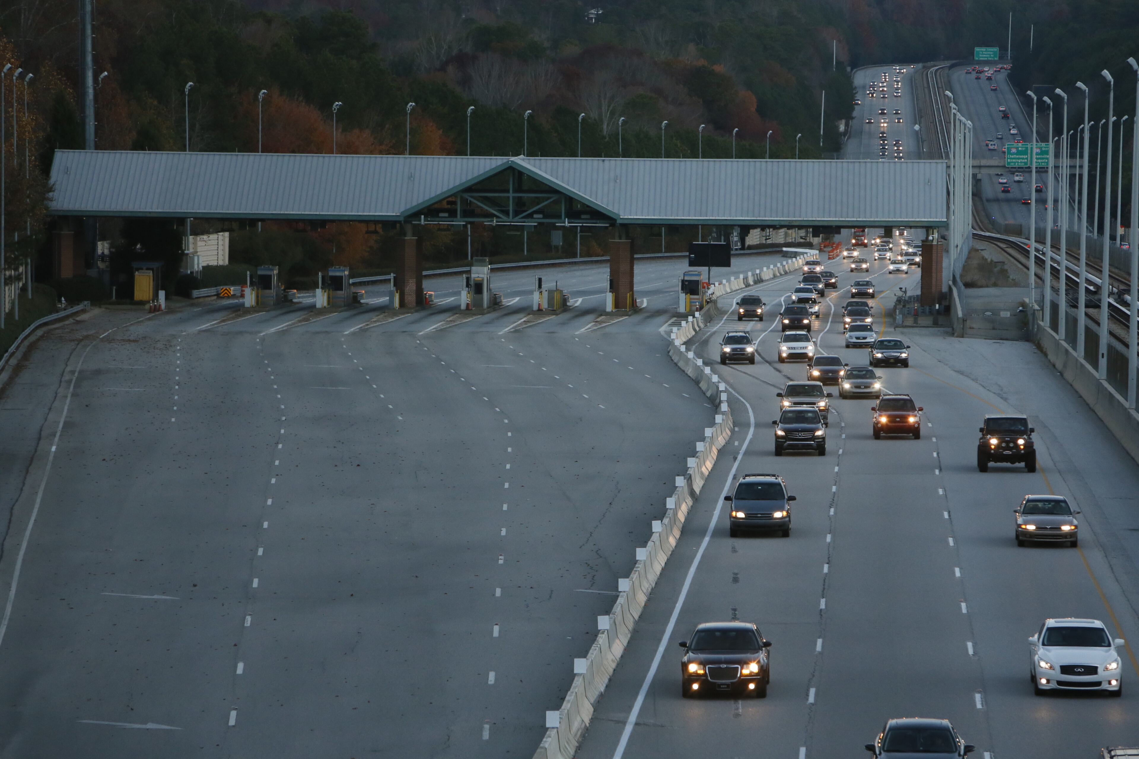 The speed limit through the construction zone will stay at 45 mph while crews work to remove the toll plaza structure. BOB ANDRES/BANDRES@AJC.COM