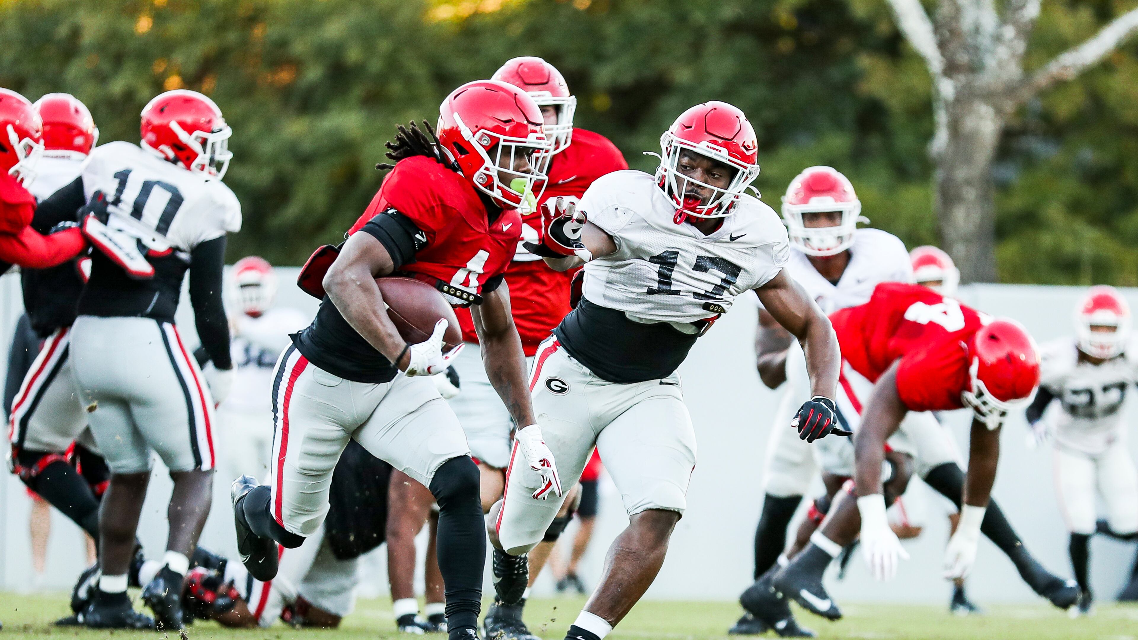 Georgia running back James Cook (4), and inside linebacker Nakobe Dean (17) are having to learn a lot of new names and faces as the Bulldogs opened preseason camp in Athens on Aug. 6, 2021 (Photo by Tony Walsh/UGA Athletics)