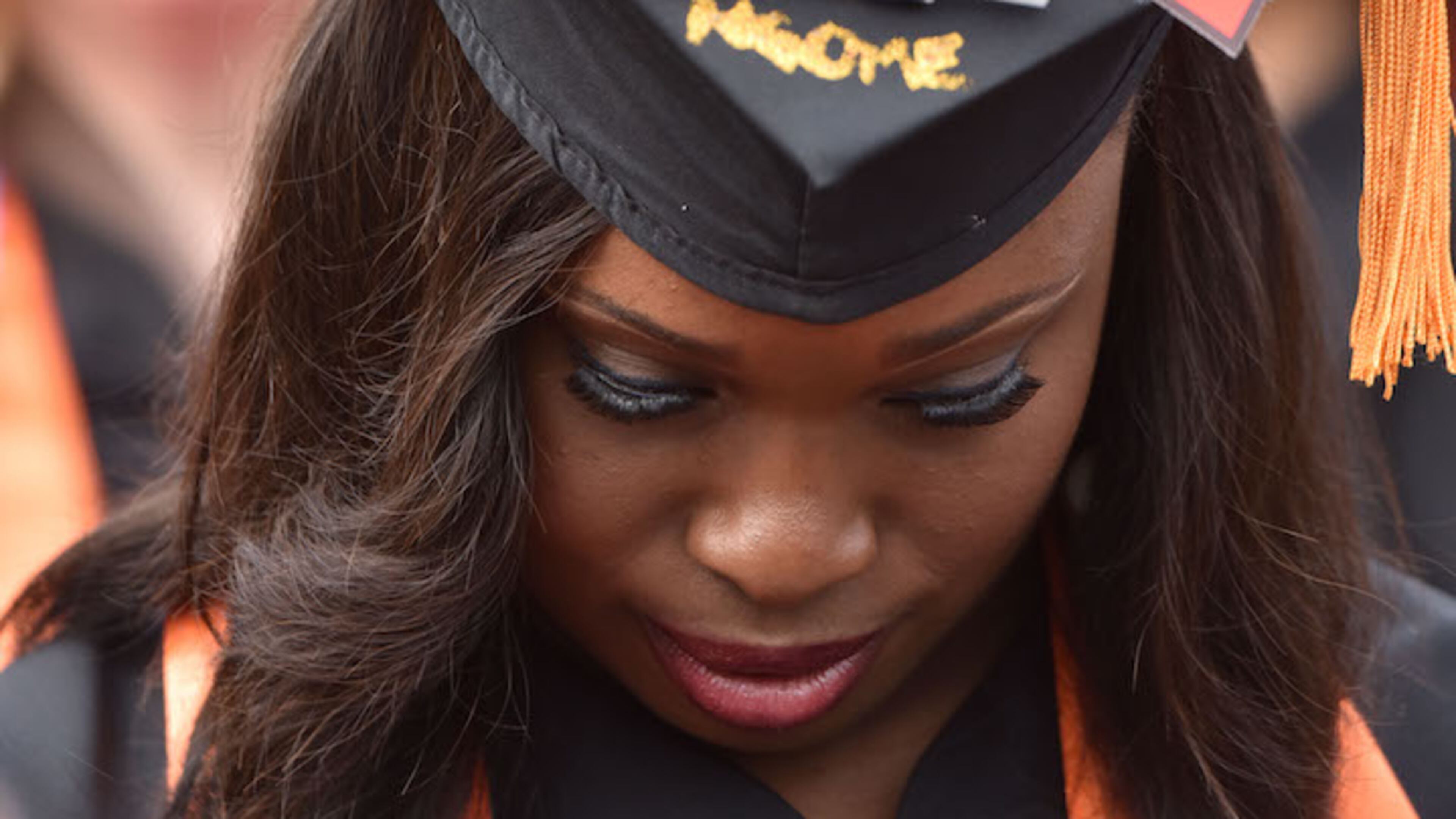 In this file photo, Nursing student Yvonne Ngome wears a personalized mortar board during Mercer University’s Atlanta campus commencement. Georgia’s colleges and universities offer myriad nursing-related degrees and certifications.