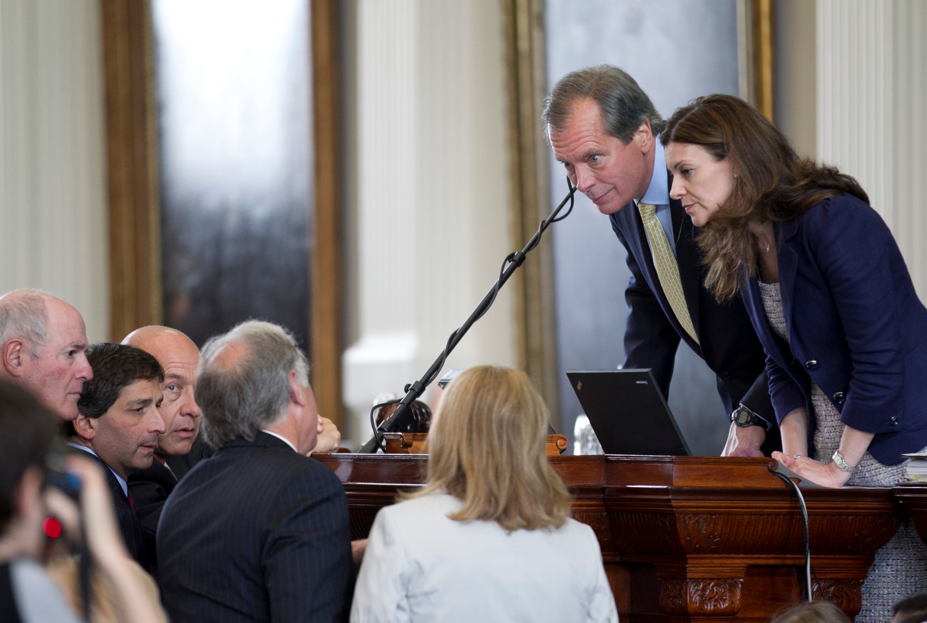 Lt. Gov. David Dewhurst, second from right, and Senate Parliamentarian Karina Davis listen to questions from senators on the first day of the second special session at the Capitol on Monday July 1, 2013.