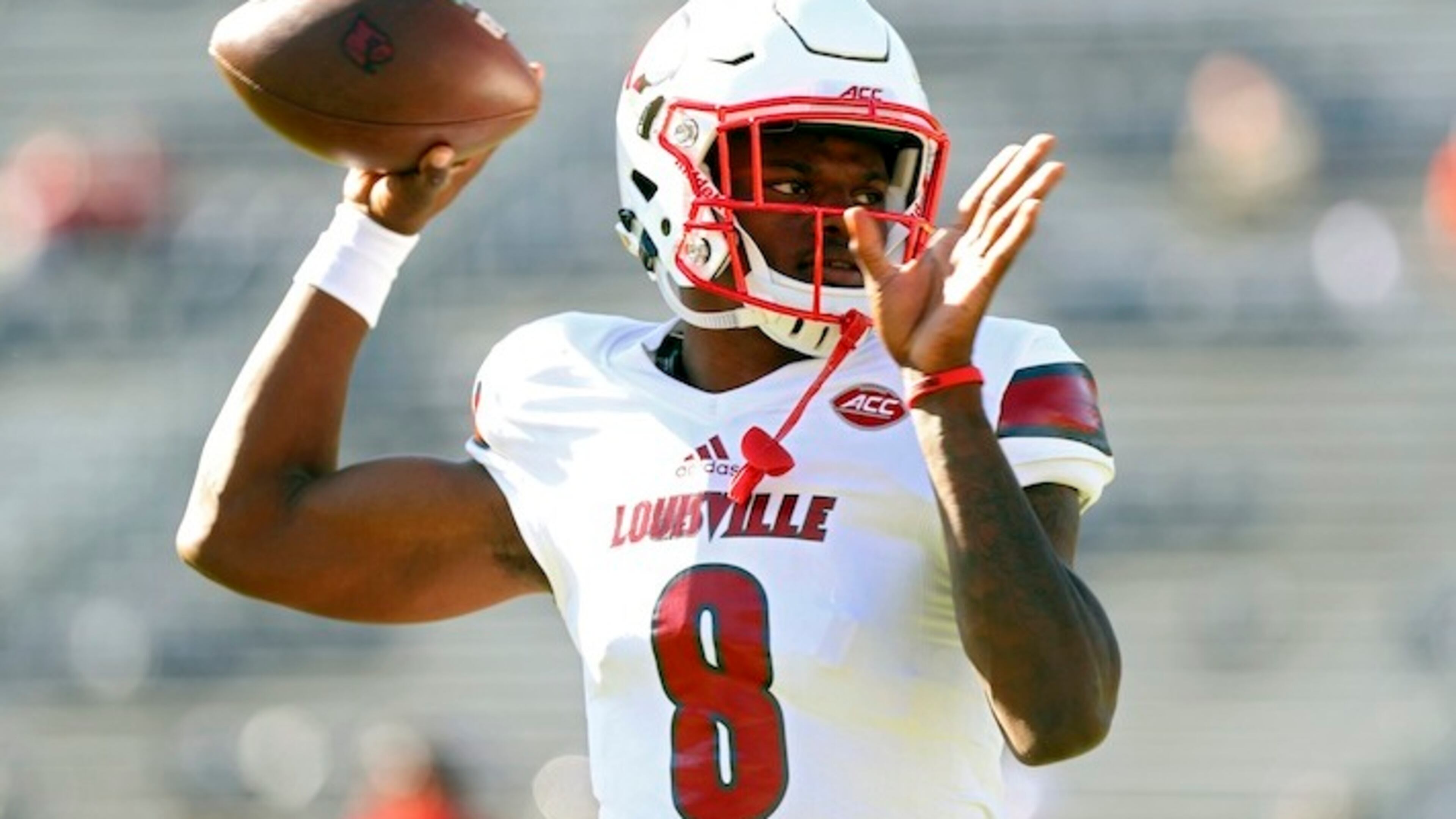 Louisville quarterback Lamar Jackson (8) throws a pass during warmups before an NCAA college football game against Virginia on Saturday, Oct. 29, 2016 in Charlottesville, Va. (AP Photo/Ryan M. Kelly)