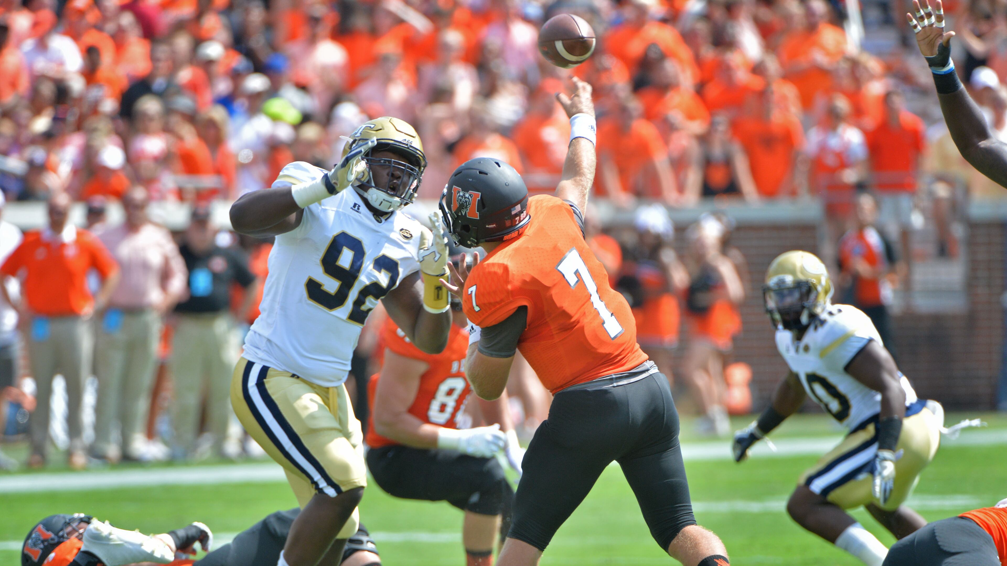 Mercer Bears quarterback John Russ (7) gets off a pass under pressure from Georgia Tech Yellow Jackets defensive lineman Francis Kallon (92) in the first half at Bobby Dodd Stadium on Saturday, September 10, 2016. HYOSUB SHIN / HSHIN@AJC.COM