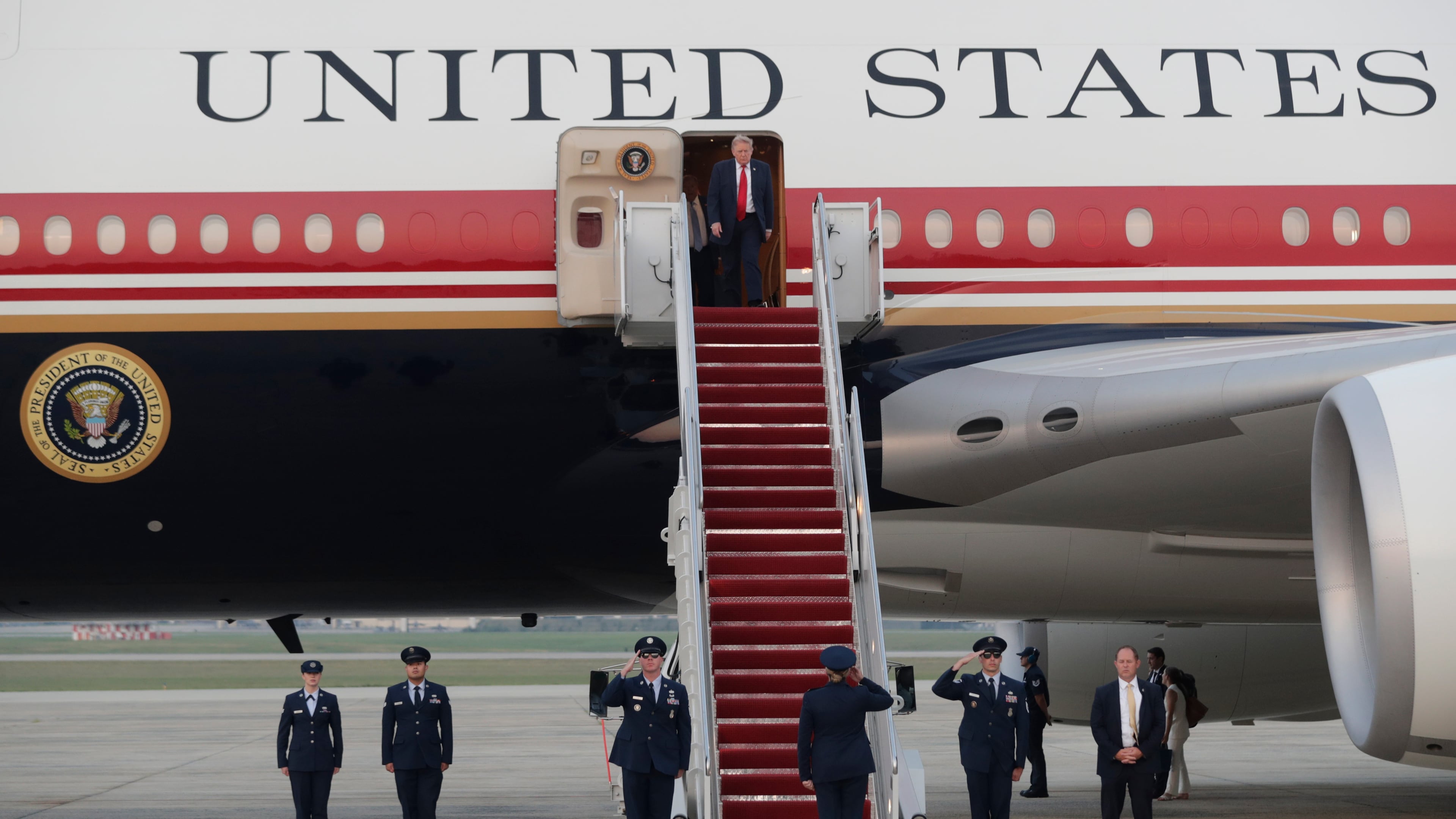 President Donald Trump walks down the stairs of Air Force One upon his arrival at Joint Base Andrews, Md., Sunday, July 19, 2026. (AP Photo/Luis M. Alvarez)