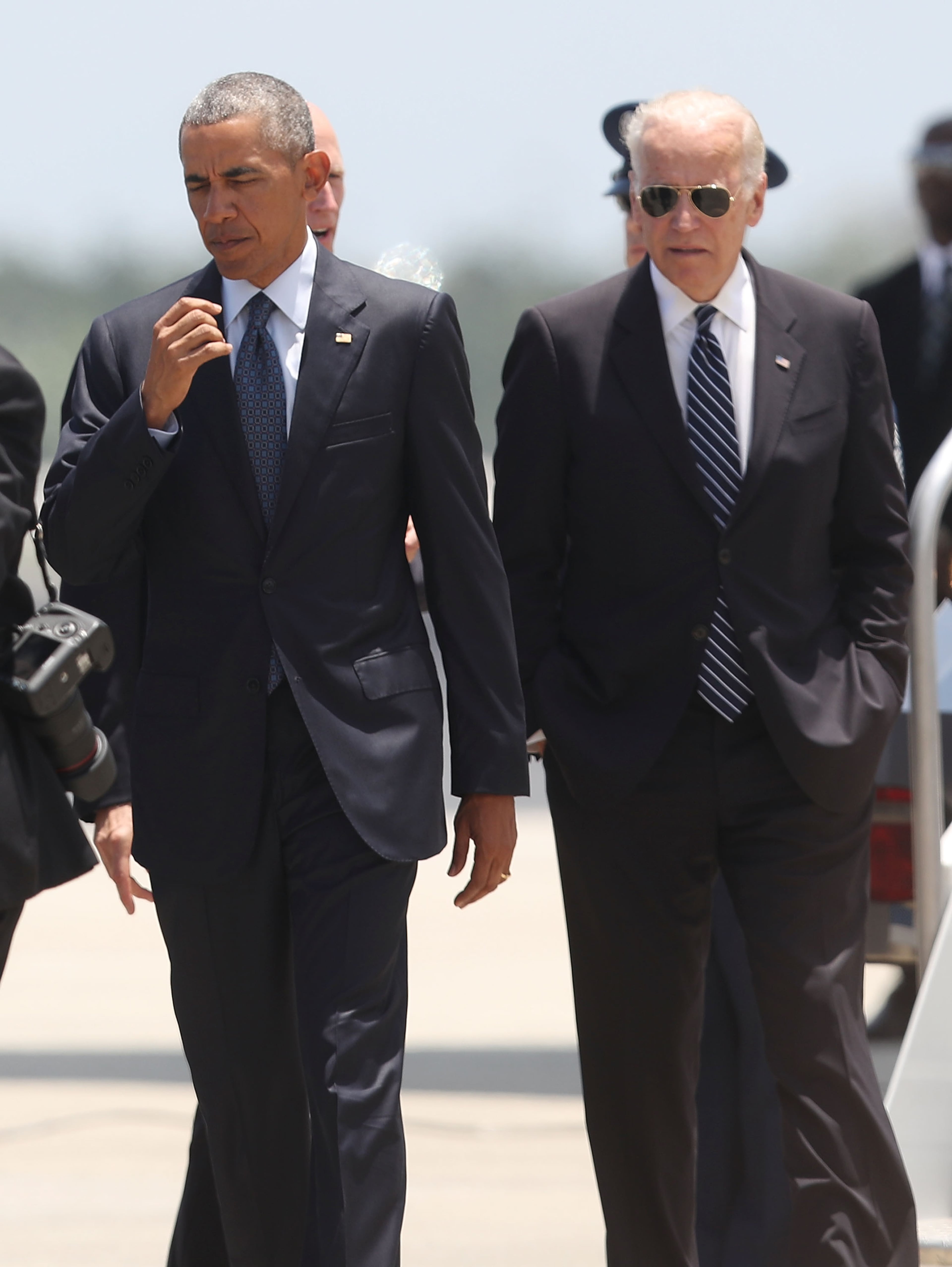 President Barack Obama and Vice President Joe Biden arrive at the Orlando International Airport to visit with family and community members after the attack at the Pulse gay nightclub where Omar Mateen killed 49 people on June 16, 2016 in Orlando, Florida. The mass shooting on June 12th killed 49 people and injured 53 others in what is the deadliest mass shooting in the country's history. (Photo by Joe Raedle/Getty Images)