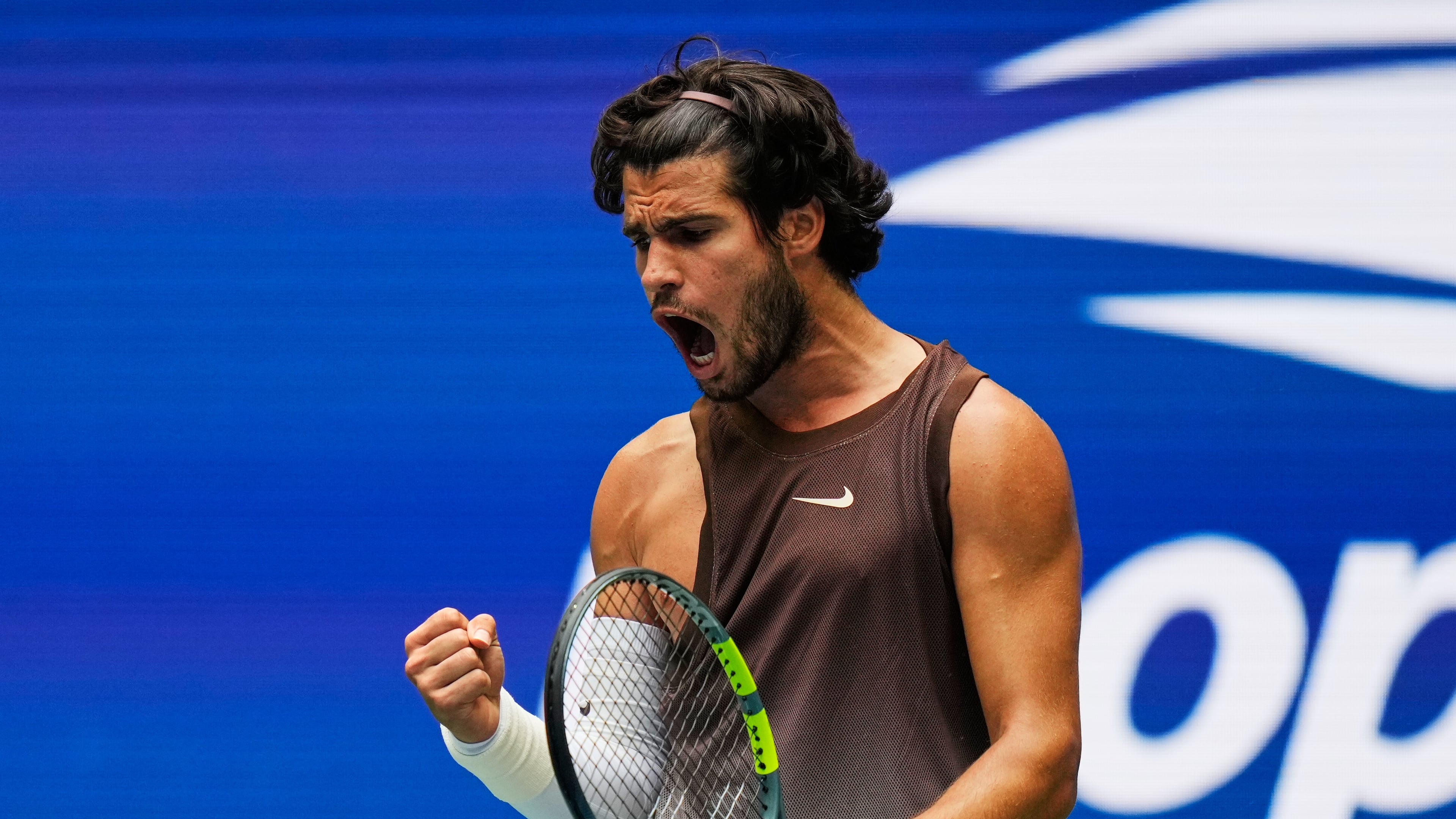 Carlos Alcaraz, of Spain, reacts during a match against Roman Safiullin, of Russia, during the first round of the U.S. Open tennis championships, Monday, Aug. 31, 2026, in New York. (AP Photo/Seth Wenig)