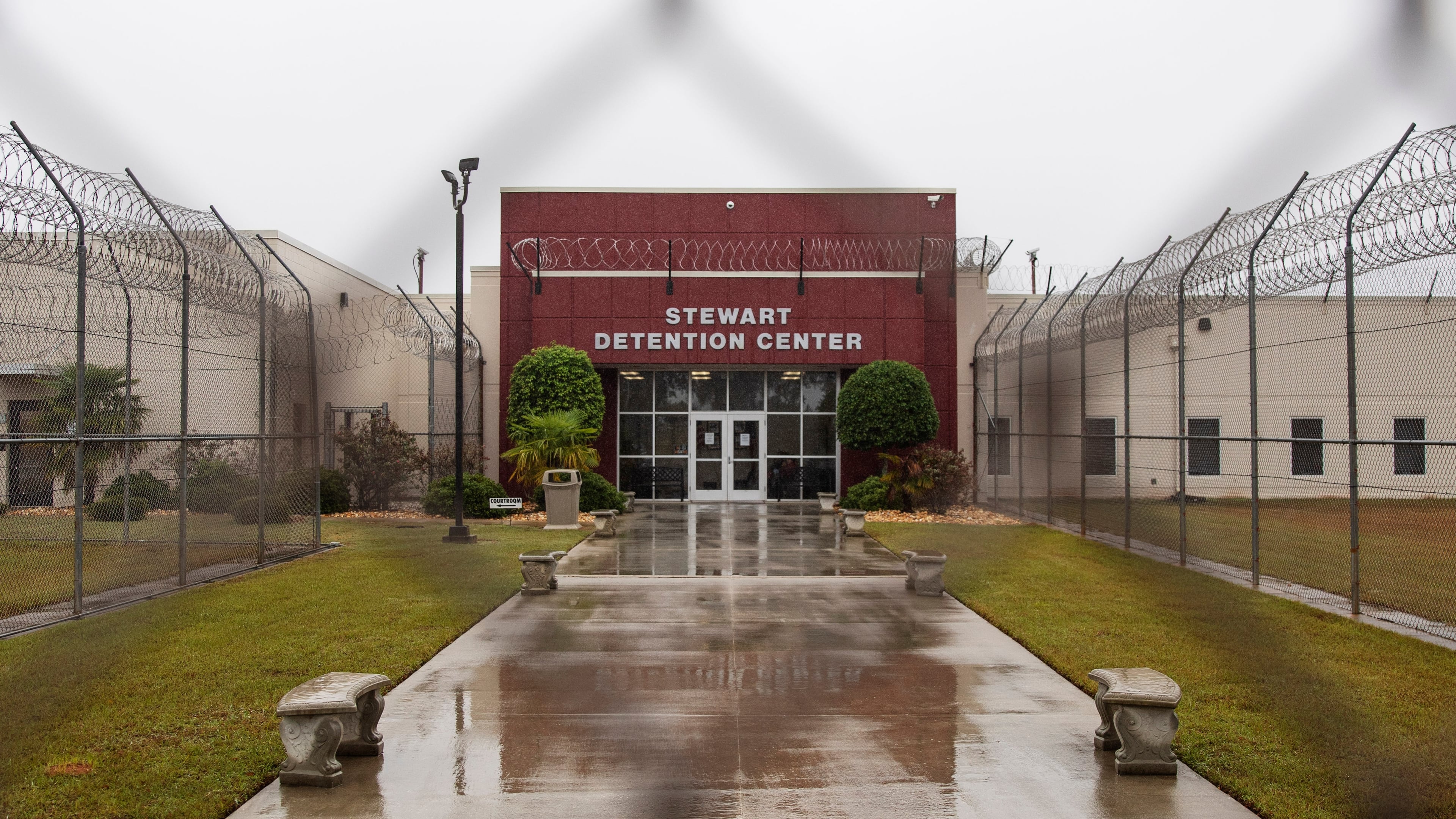 The Stewart Detention Center in Lumpkin, Ga., is seen through the front gate, on Friday, Nov. 15, 2019. Immigration and Customs Enforcement is seeking to deport an Iranian woman being held there to the Central African Republic. (David Goldman/AP 2019)