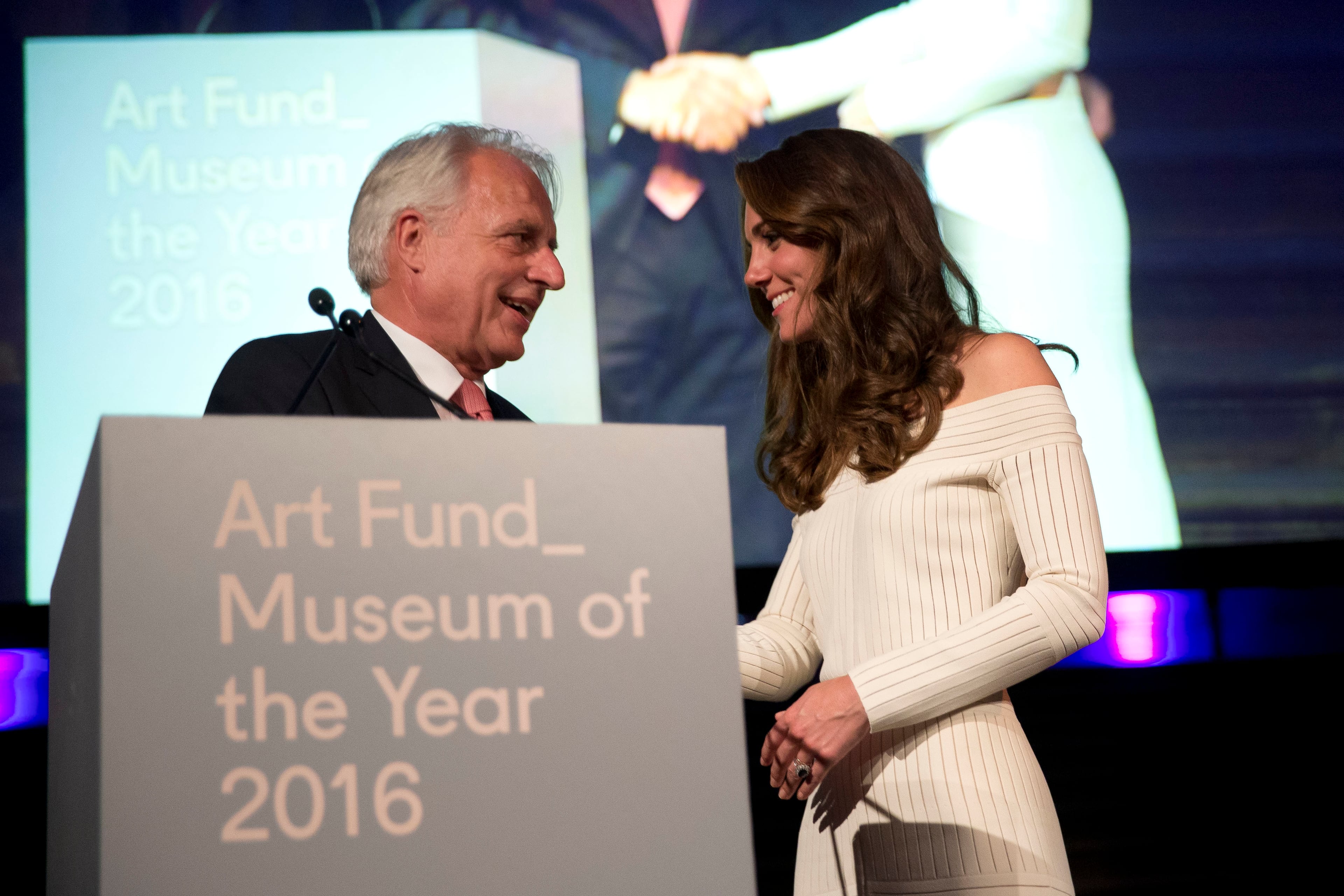 Britain's Kate the Duchess of Cambridge congratulates Germany's Martin Roth the Director of the Victoria and Albert Museum in his capacity as the representative of the winner of the Art Fund Museum of the Year 2016 prize, at the Natural History Museum in London, Wednesday, July 6, 2016. The Art Fund Museum of the Year prize is awarded annually to one outstanding museum which has shown exceptional imagination, innovation and achievement in the preceding year. (AP Photo/Matt Dunham, Pool)