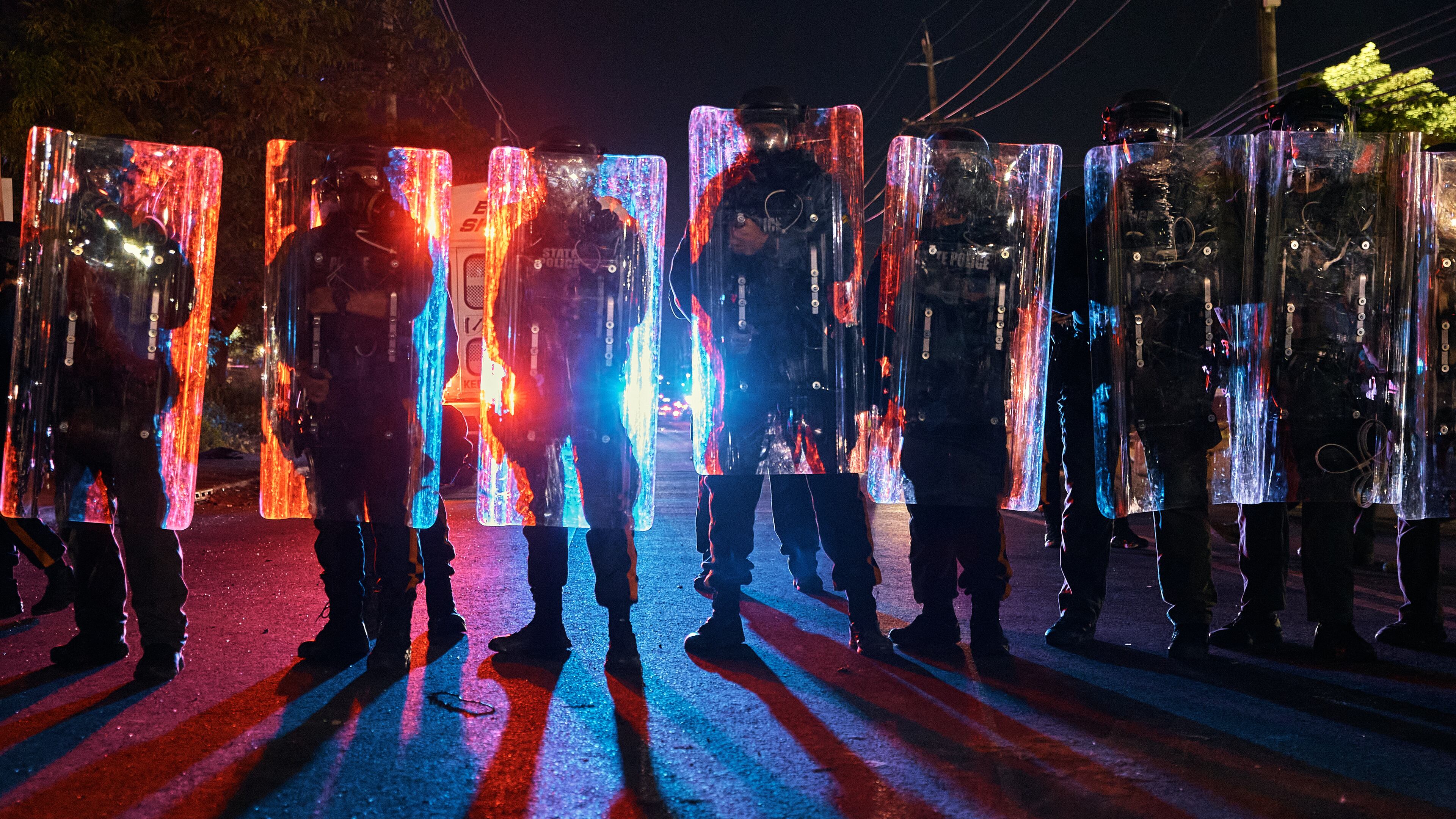 Police stand behind their shields as they prepare to clash with protesters outside the Delaney Hall detention center during a protest against the transfer of detainees and federal immigration policies on Saturday, May 30, 2026, in Newark, N.J. (AP Photo/Andres Kudacki)