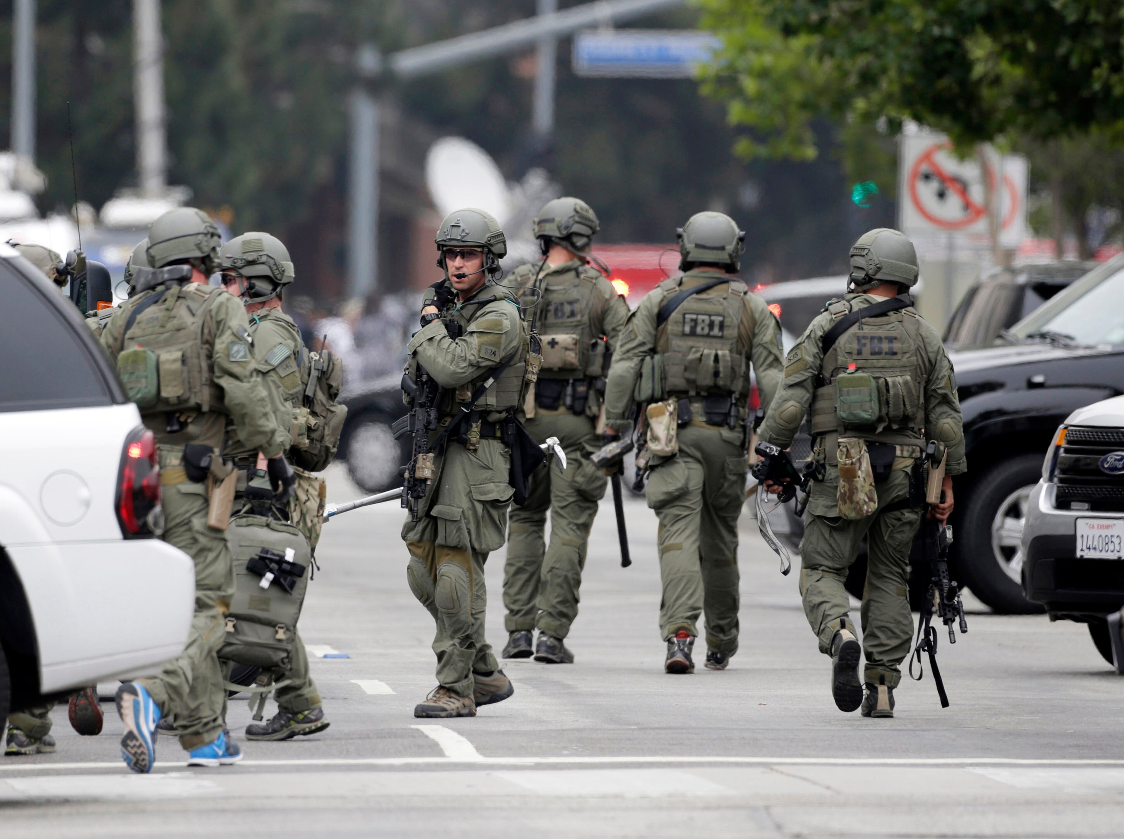An FBI SWAT team arrives at the scene of a fatal shooting at the University of California, Los Angeles, Wednesday, June 1, 2016, in Los Angeles. (AP Photo/Nick Ut)