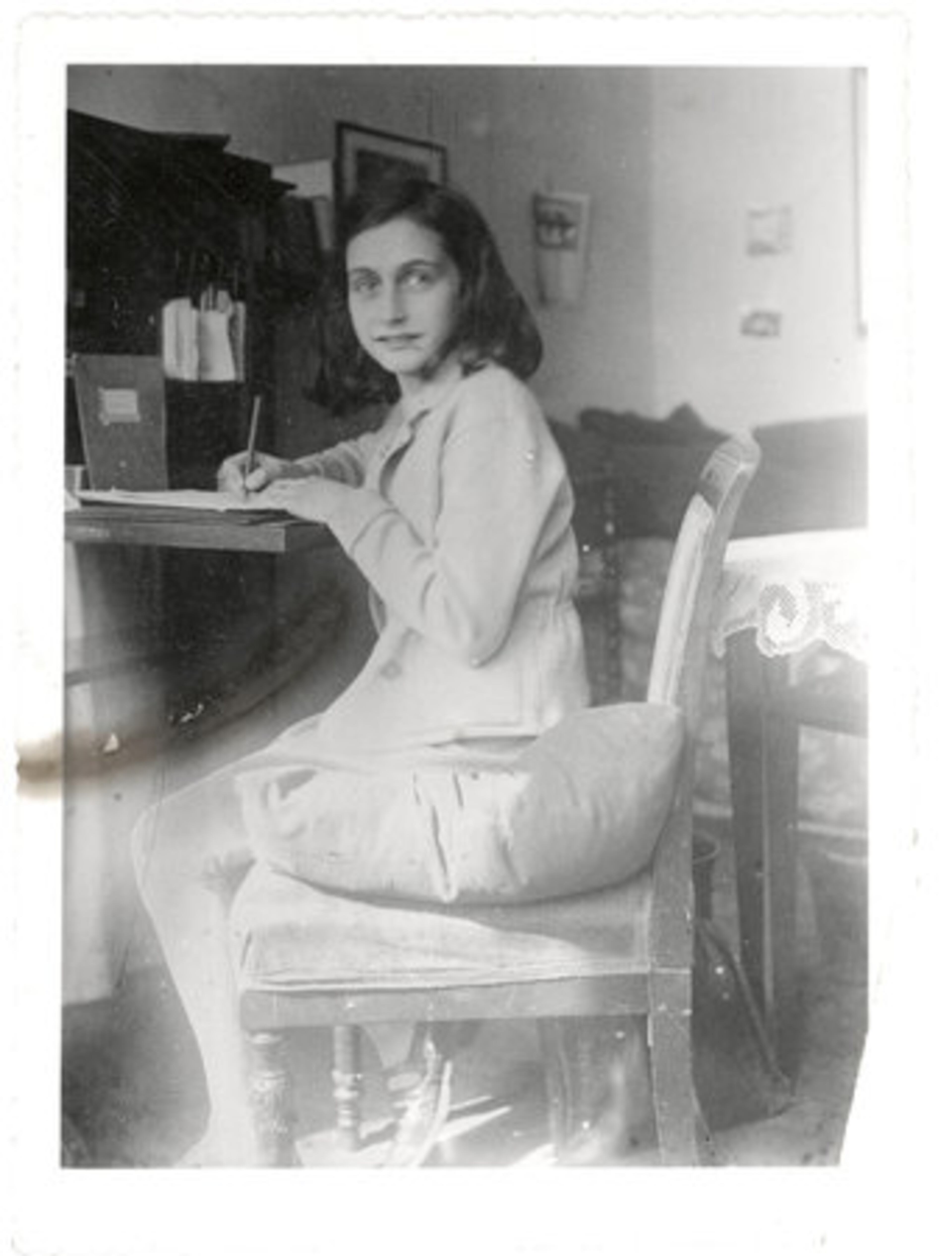 Anne Frank is seen writing in this April 1941 photo. Her posthumously published diary and other writings have been an inspiration to millions of people worldwide.
