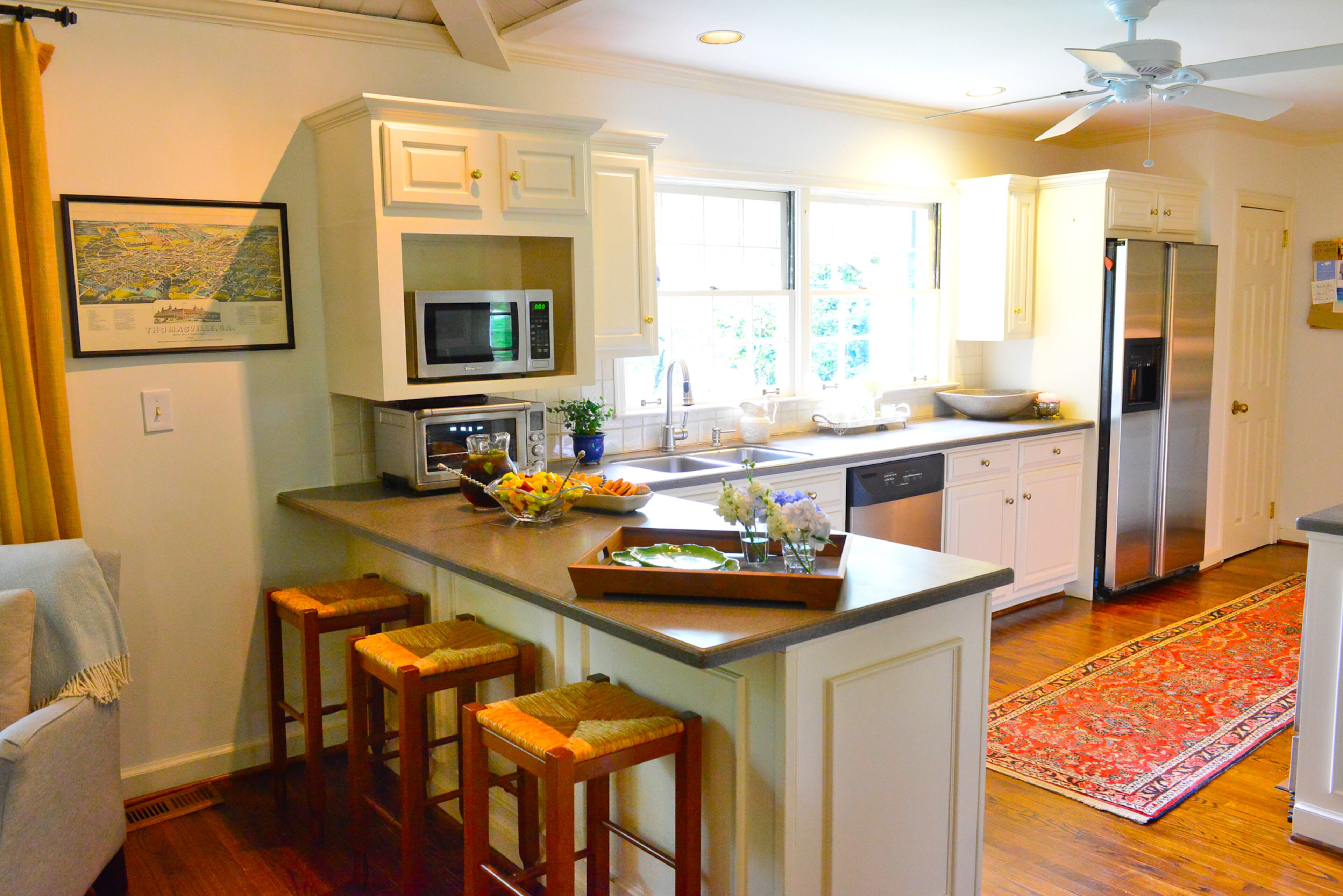 Having the peninsula in the kitchen is a great place to set out light appetizers/drinks while entertaining, but the Callaways also use it on a daily basis when doing light work from home or even while talking to each other or guests when cooking.