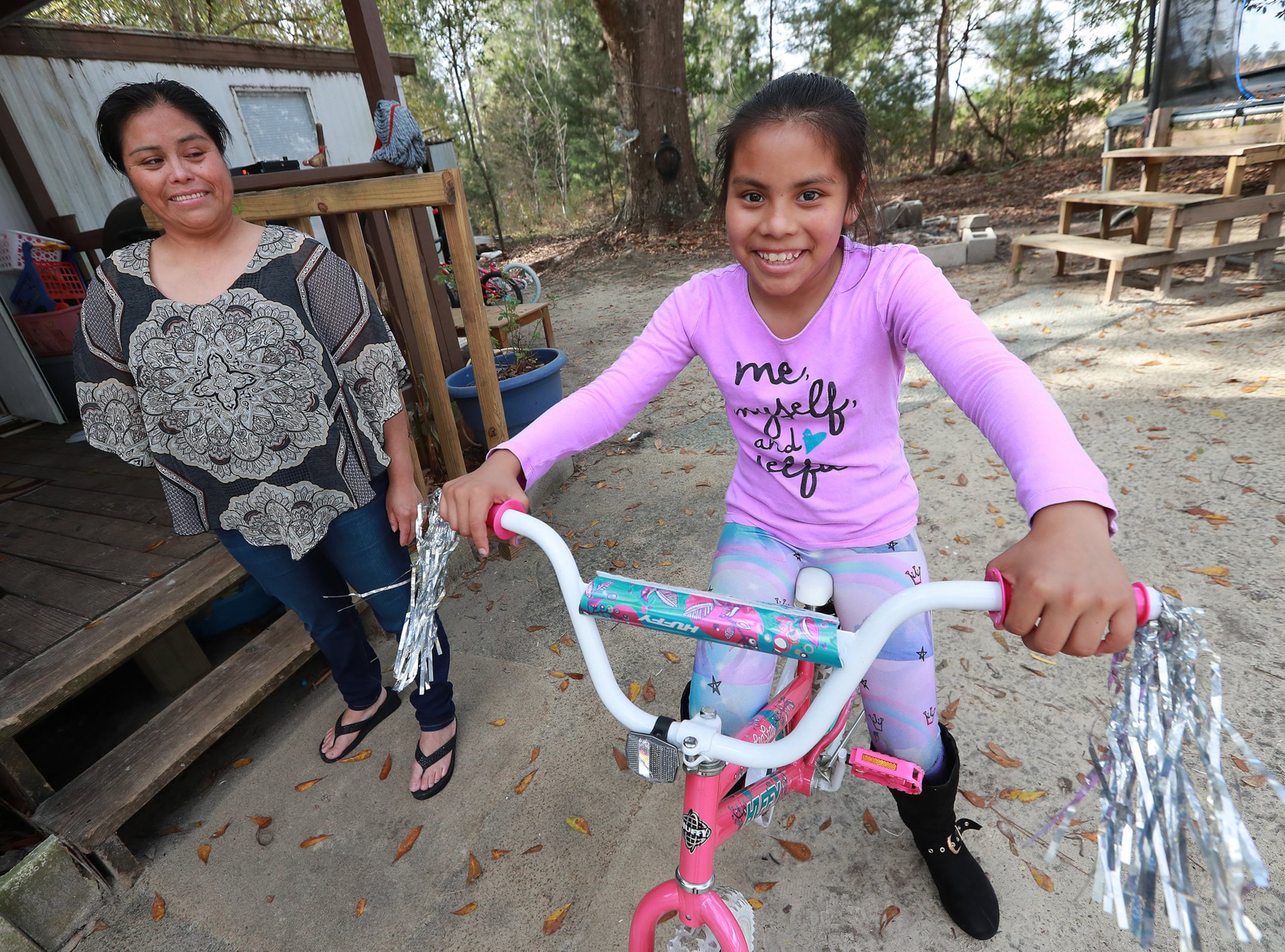 Vilma Carrillo, a Guatemalan woman seeking asylum in the United States, and her 12-year-old daughter Yeisvi. They were recently reunited after being separated for many months following Vilma’s arrest on the southwest border. They share a mobile home with other relatives in Vidalia. Curtis Compton/ccompton@ajc.com Curtis