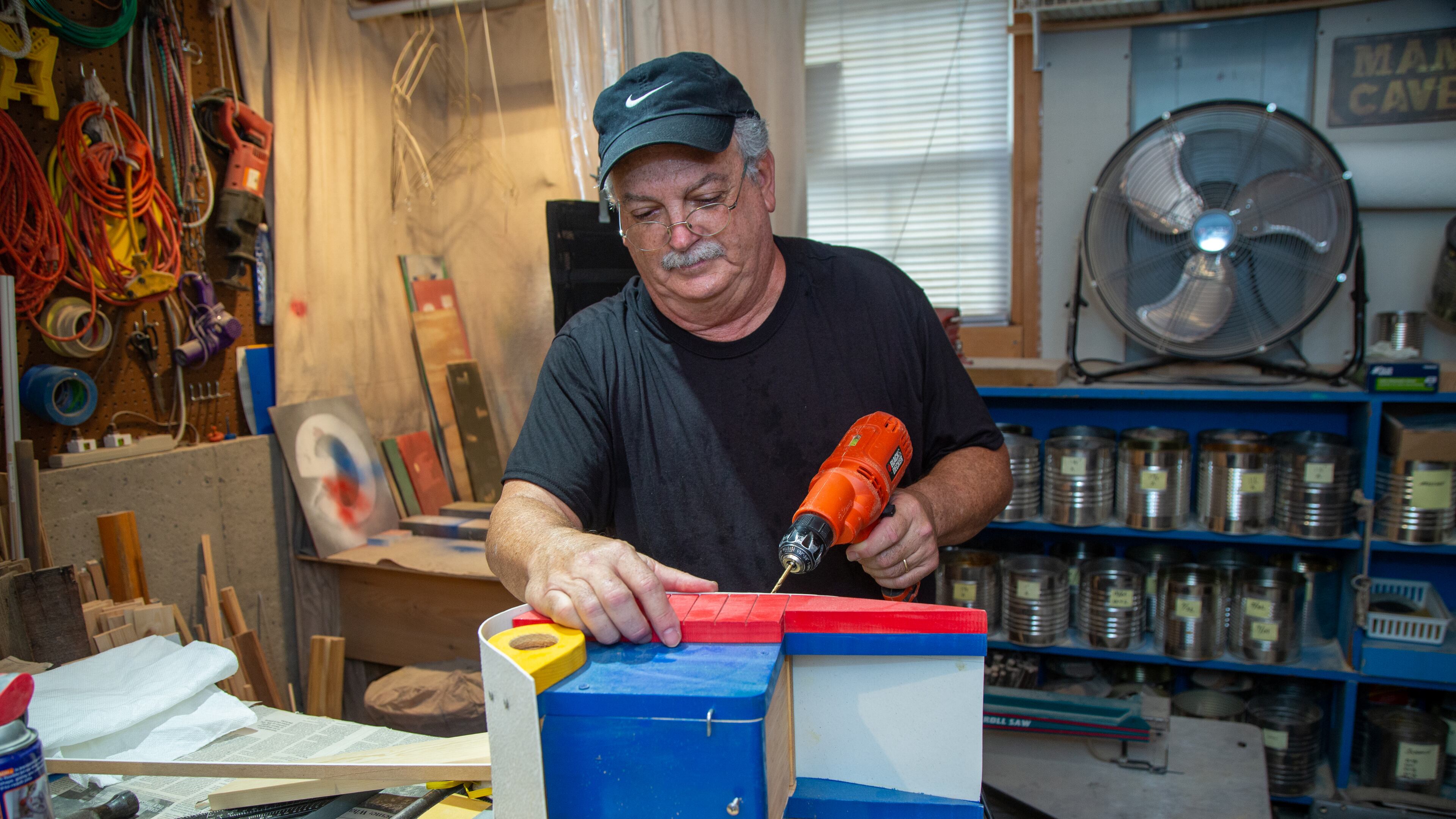Dr. Jon Saulson works on a woodworking project in the basement of his Snellville home. When Dr. Saulson retired as an educator he got into woodworking making toys, puzzles games, figurines and art out of wood. Numerous people and groups wanted him to do craft shows with them, but it turned his joy into "work.Ó So for the past 10 years, he has donated loads of his creations to several people & agencies that might need them for the children and families they serve. In return he gets the pure joy, satisfaction, a sense of making others happy. PHIL SKINNER FOR THE ATLANTA JOURNAL-CONSTITUTION.