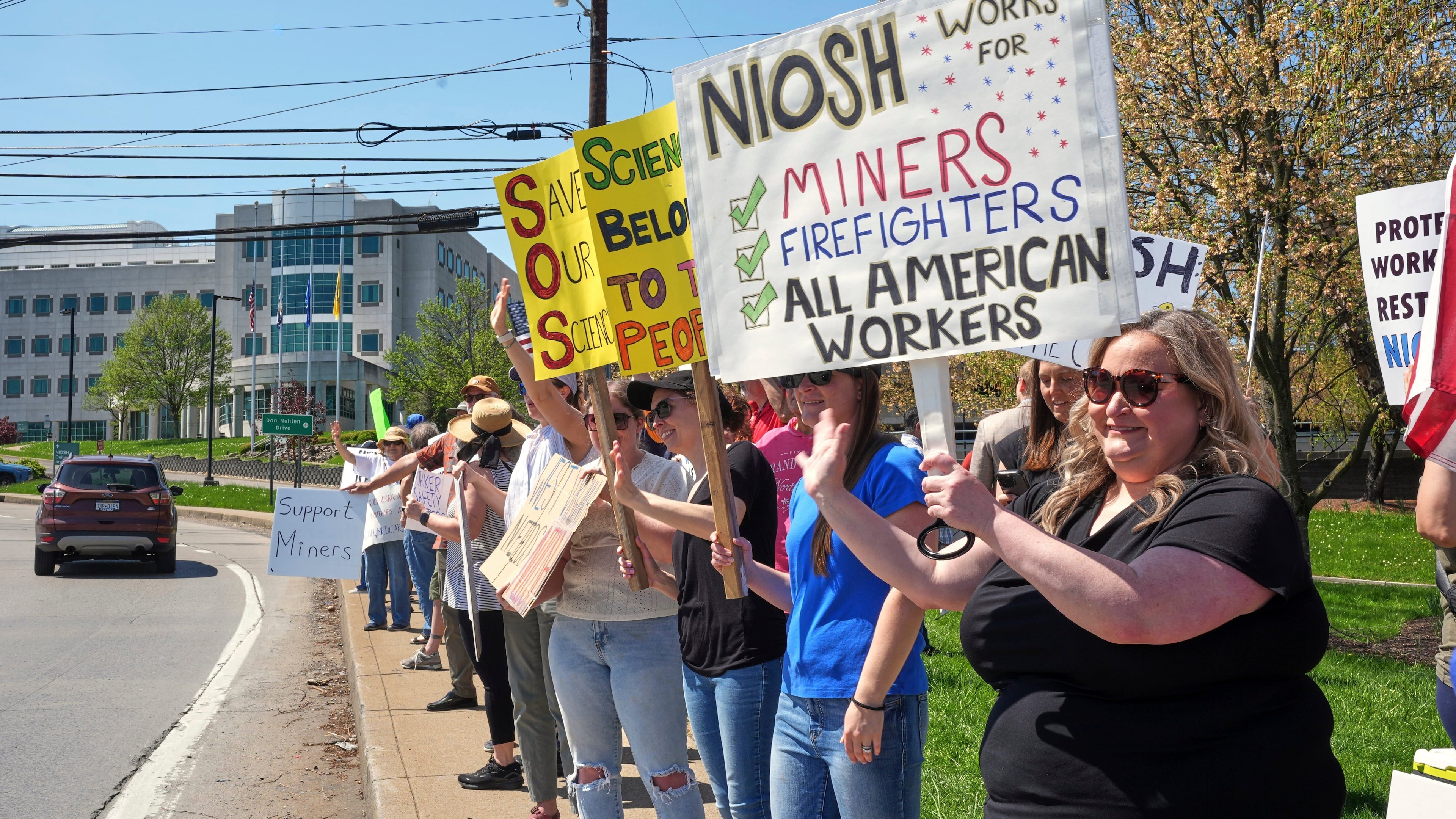 FILE - People rally on Wednesday, April 23, 2025, in support of some 185 researchers and other employees of the National Institute for Occupational Safety and Health (NIOSH) in Morgantown, W.Va., who received reduction-in-force notices as part of a larger push by the U.S. Department of Health and Human Services to dismiss 10,000 federal employees. (AP Photo/Gene J. Puskar, File)