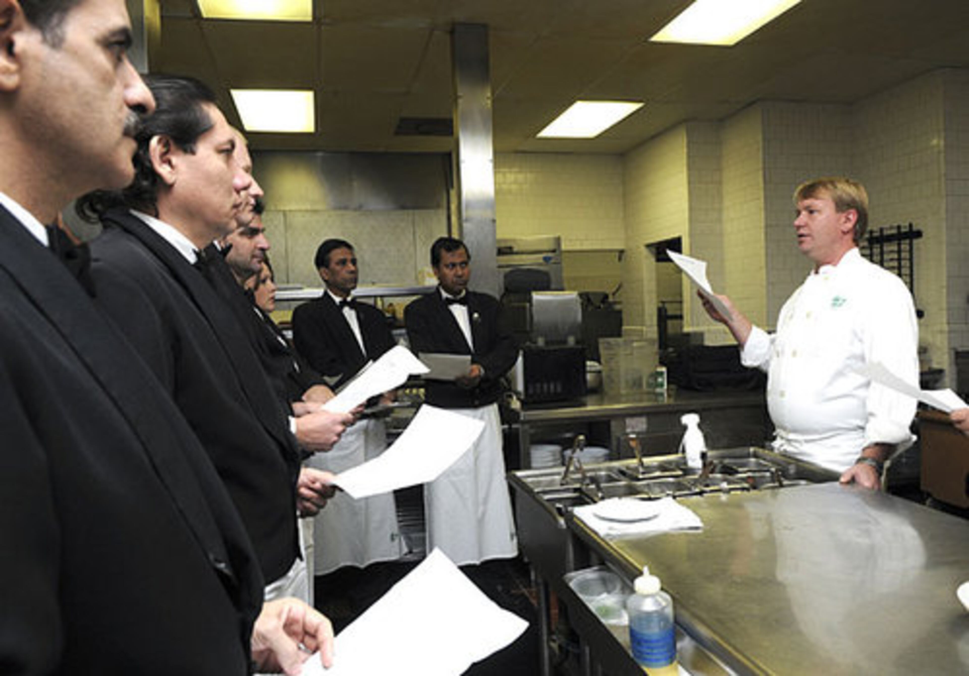Chef Gary Donlick goes over the menu with the staff before opening.