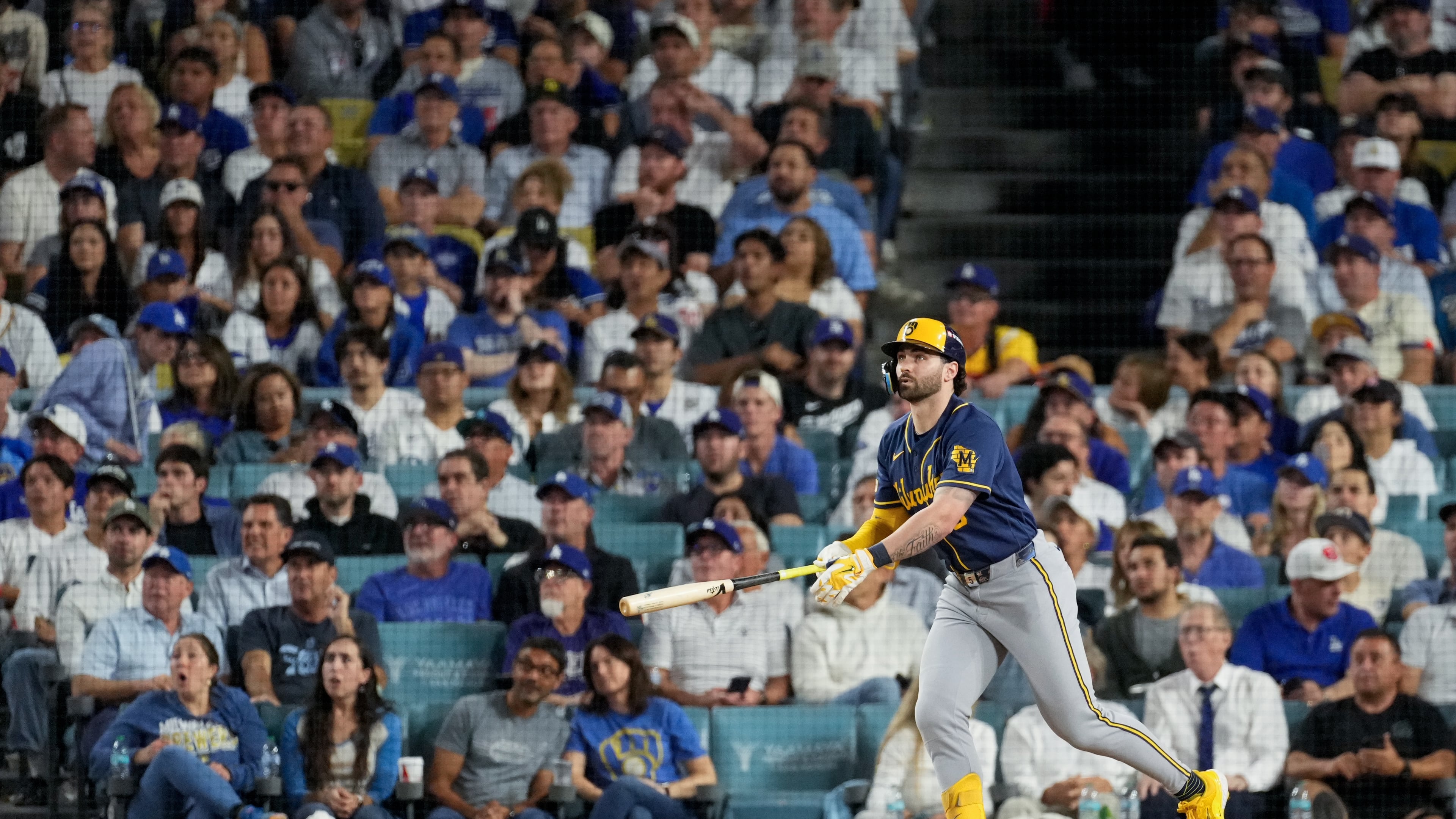 Milwaukee Brewers center fielder Garrett Mitchell follows through on his solo home run during the sixth inning of Game 4 of baseball's National League Championship Series between the Milwaukee Brewers and the Los Angeles Dodgers, Thursday, Oct. 15, 2026, in Los Angeles. (AP Photo/Mark J. Terrill)