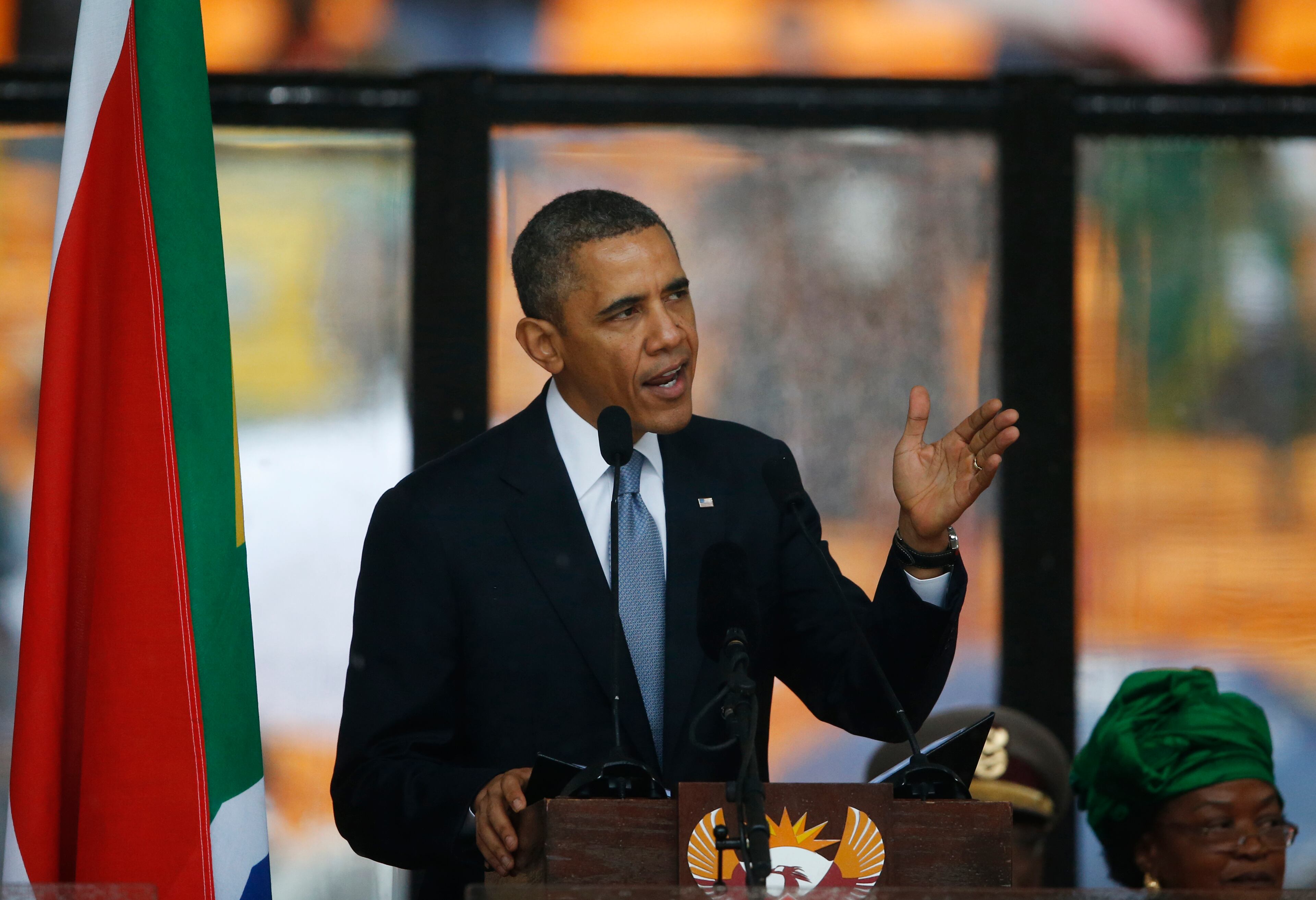 President Barrack Obama speaks to crowds attending the memorial service for former South African president Nelson Mandela at the FNB Stadium in Soweto near Johannesburg, Tuesday, Dec. 10, 2013. (AP Photo/Matt Dunham)