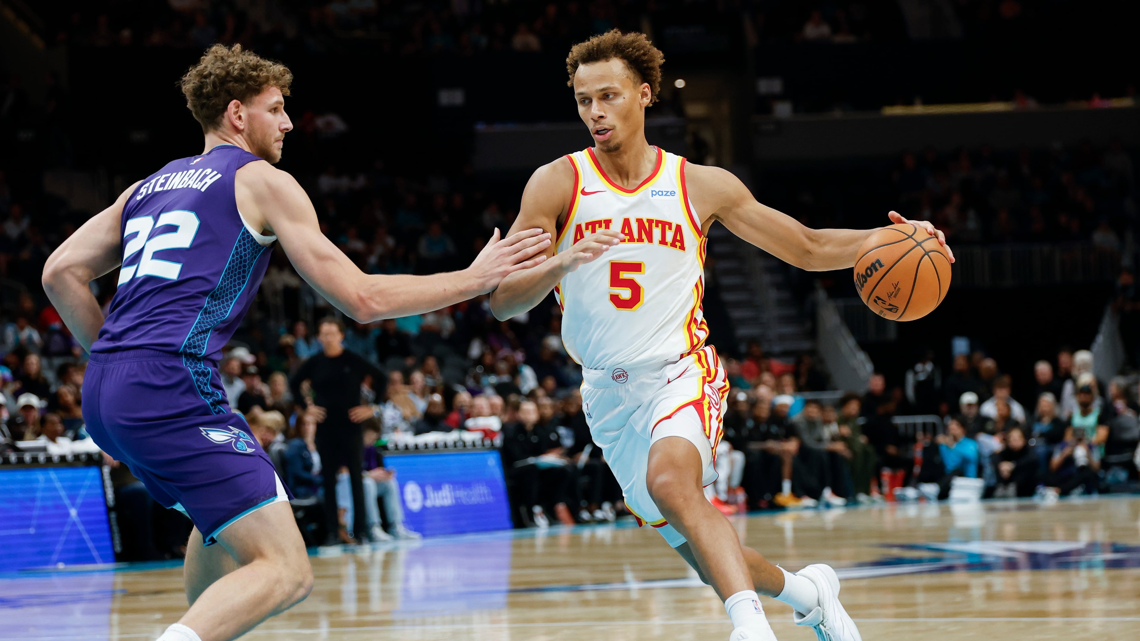 Atlanta Hawks guard Dyson Daniels drives to the basket against Charlotte Hornets forward Hannes Steinbach (left) during the second half of an NBA basketball game in Charlotte, N.C., Friday, Oct. 23, 2026. (Nell Redmond/AP)