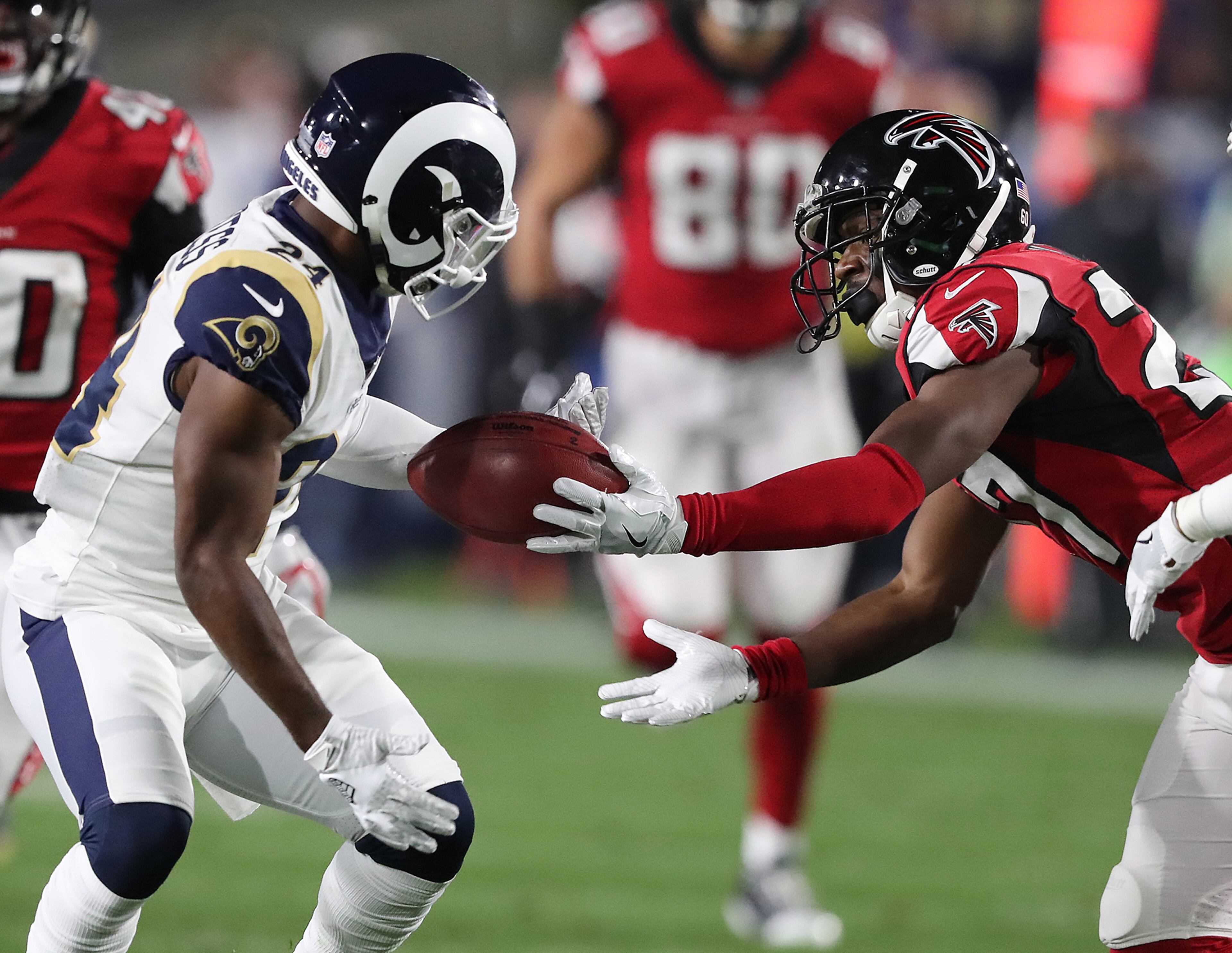 January 6, 2018 Los Angeles: The Rams Blake Countess miss handles the kick off while Falcons safety Damontae Kazee battles for the ball with the Falcons coming up with the turnover during the first quarter in their NFL Wild Card Game on Saturday, January 6, 2018, in Los Angeles. Curtis Compton/ccompton@ajc.com