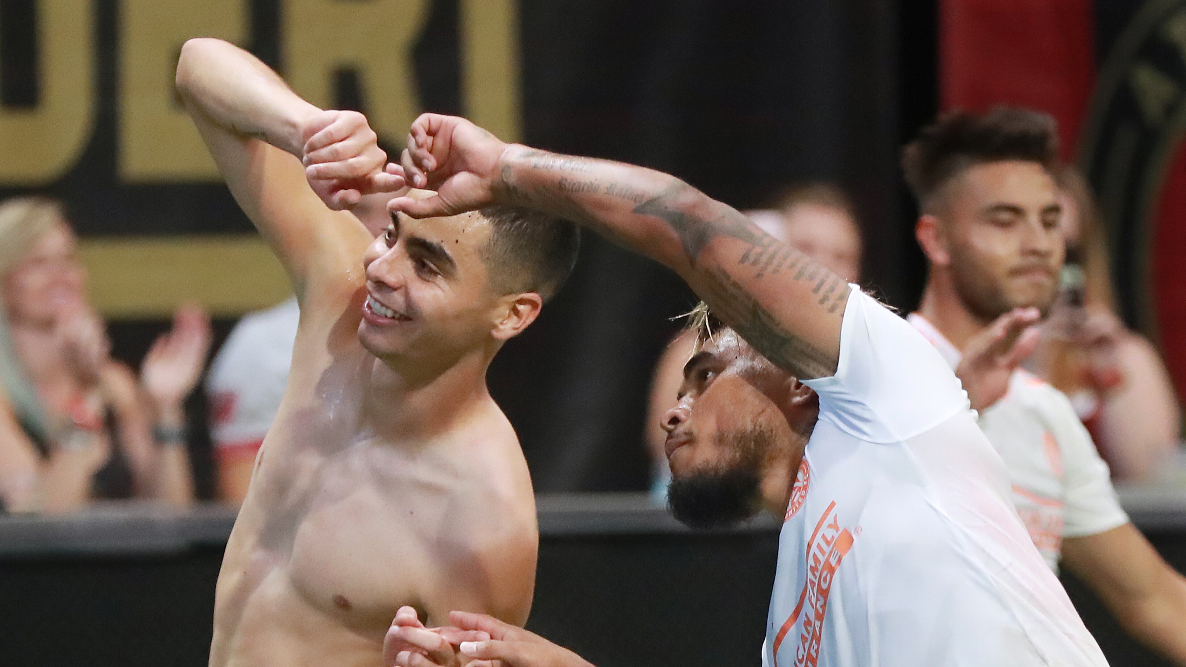Atlanta United midfielder Miguel Almiron (left) celebrates his goal against Columbus Crew with Josef Martinez for a 3-1 victory during the second half in a MLS soccer match on Sunday, August 19, 2018, in Atlanta. Martinez had an assist on the goal and also tied the MLS season scoring record with his 27th goal during the first half. Curtis Compton/ccompton@ajc.com