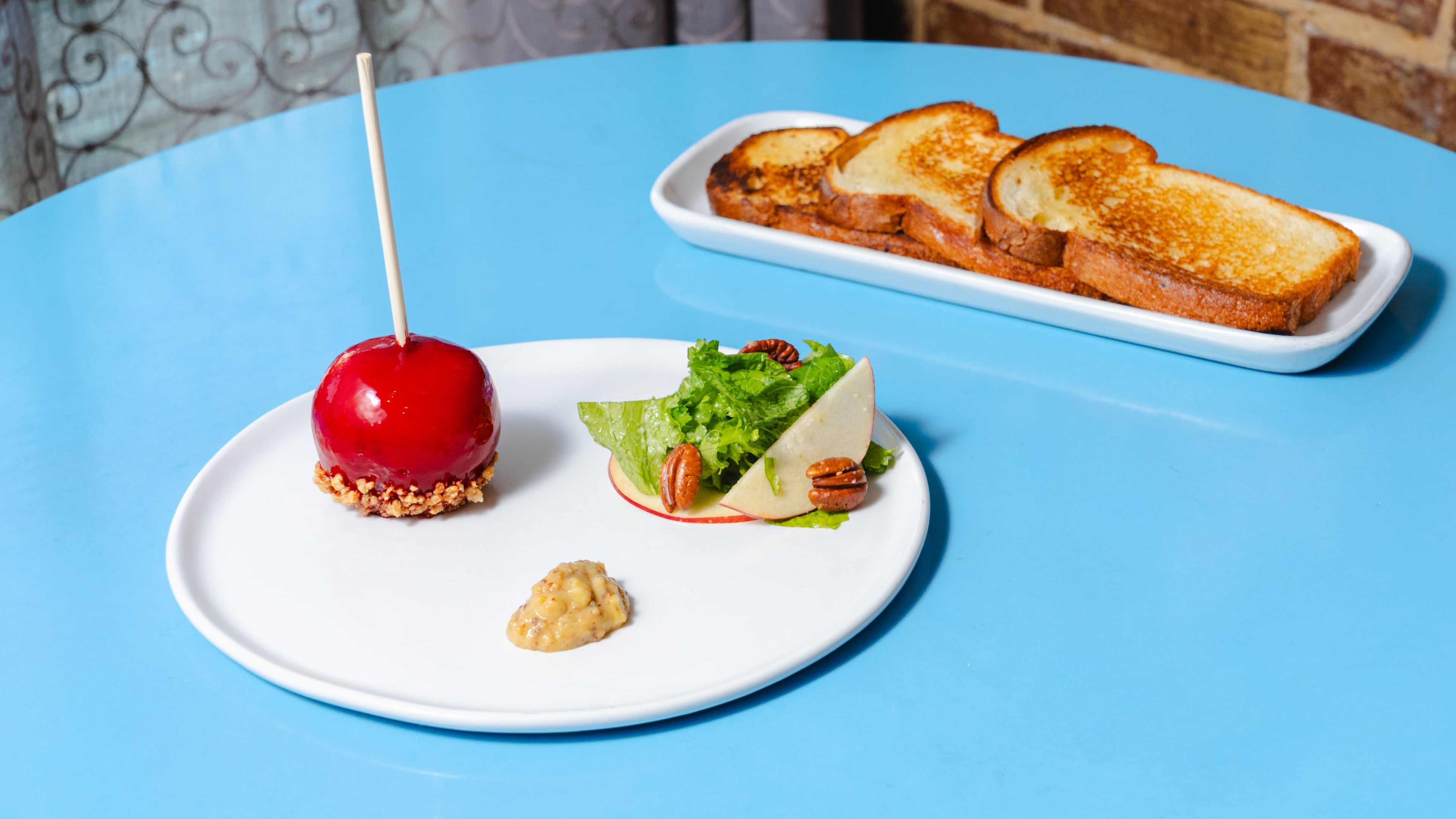Chef Joey Ward's foie gras candied apple is a playful sleight of hand at twin restaurants Southern Belle and Georgia Boy. (Courtesy of Southern Exposure Media)
