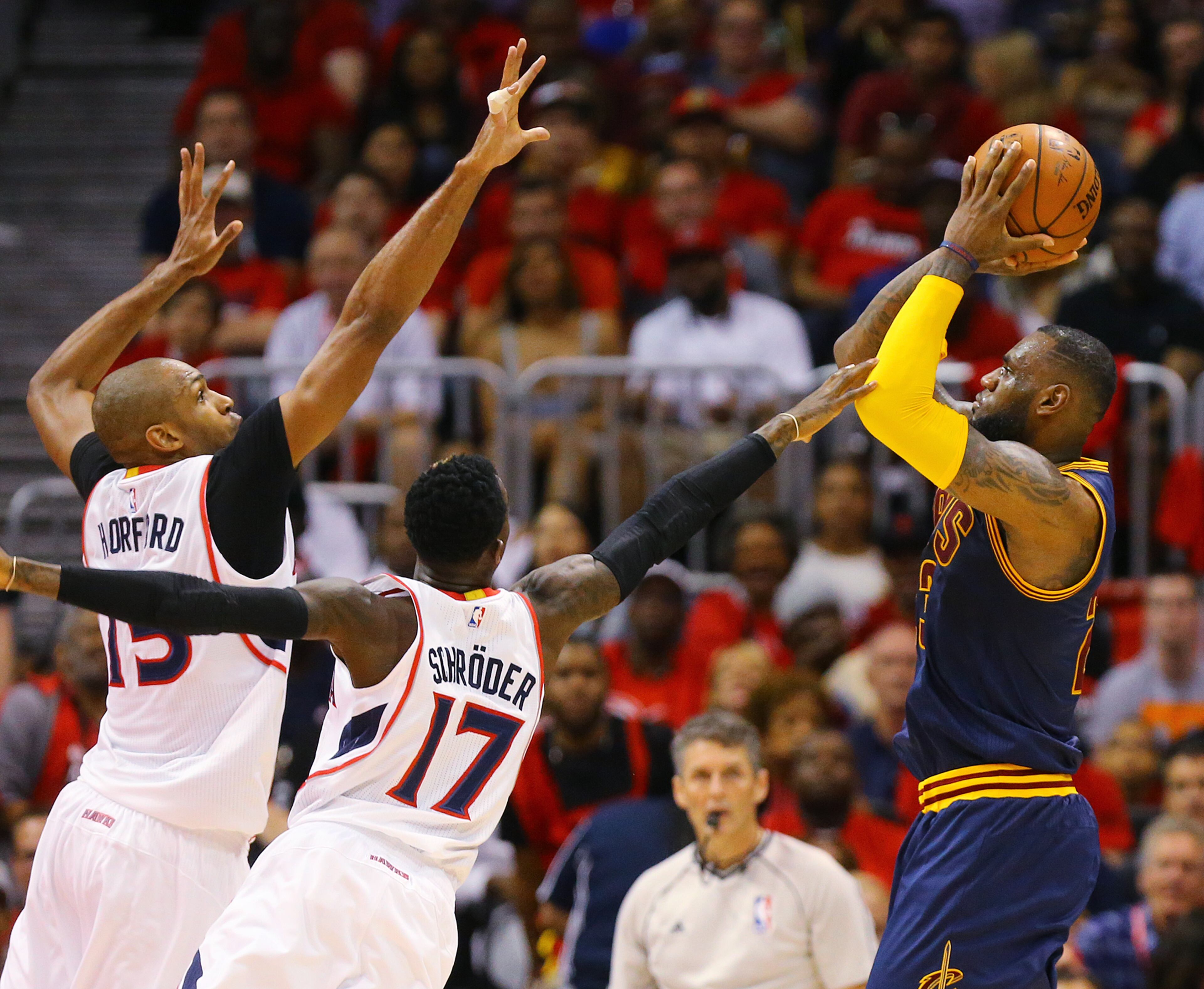 Hawks Al Horford and Dennis Schroder double team Cavaliers LeBron James who gets off a shot in game 1 of the Eastern Conference Finals on Wednesday, May 20, 2015, in Atlanta. Curtis Compton / ccompton@ajc.com