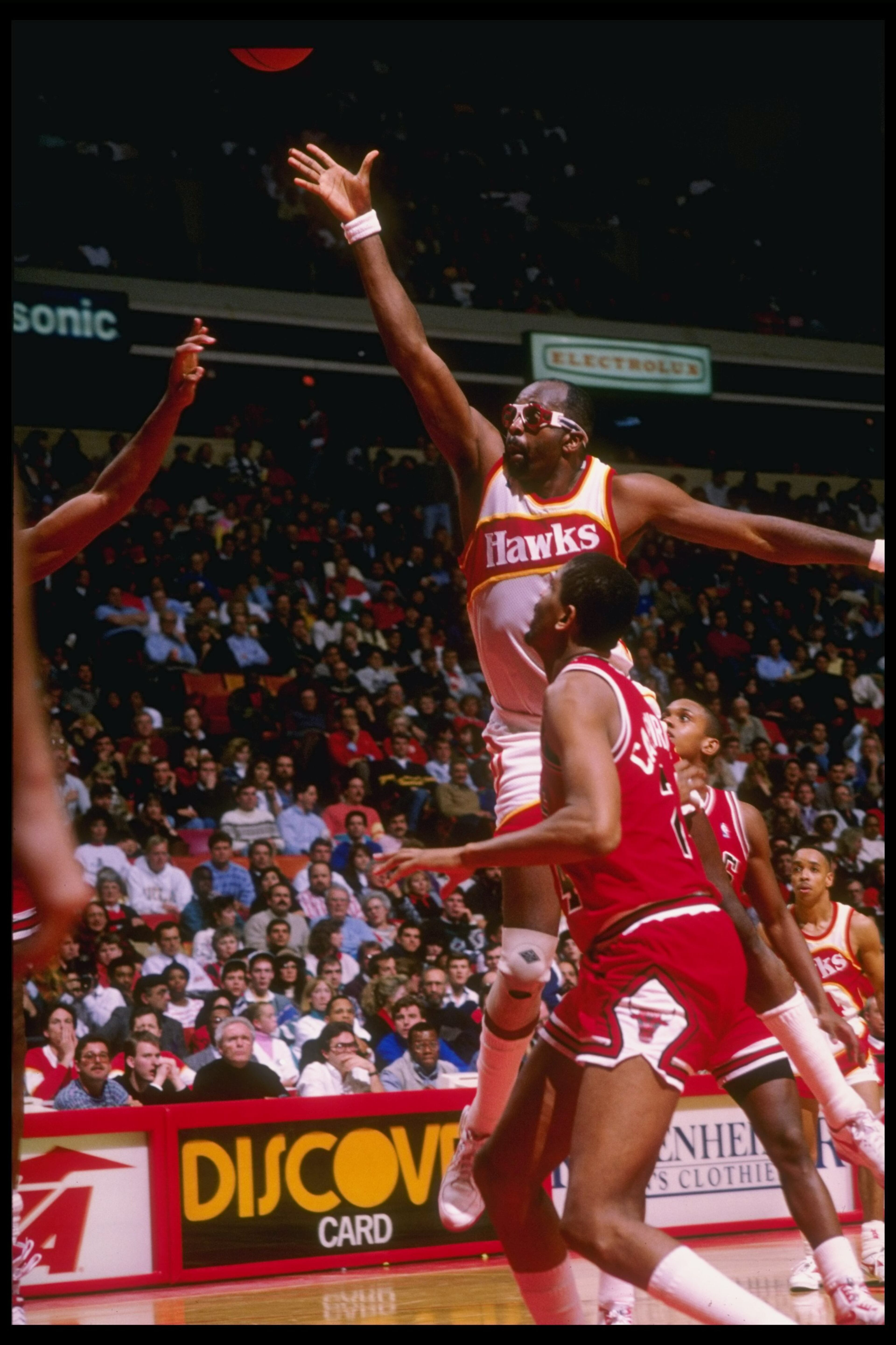 Center Moses Malone takes flight against the Chicago Bulls at The Omni in Atlanta.