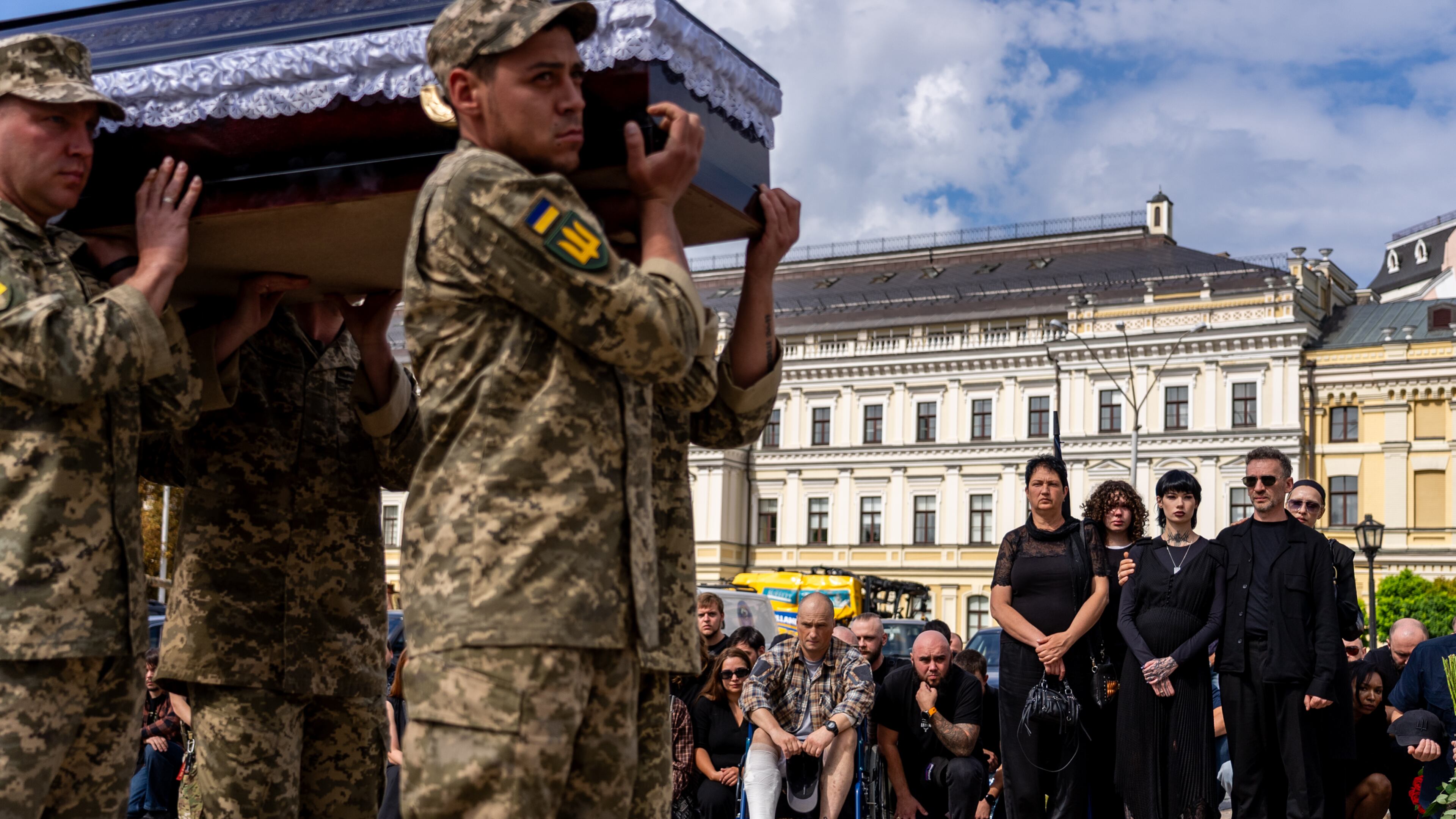 Family and friends pay their respects to soldier Danyil Smyrnov, 21, who was killed on the frontline, during his funeral ceremony in Kyiv, Ukraine, Thursday, Sept. 3, 2026. (AP Photo/Alex Babenko)