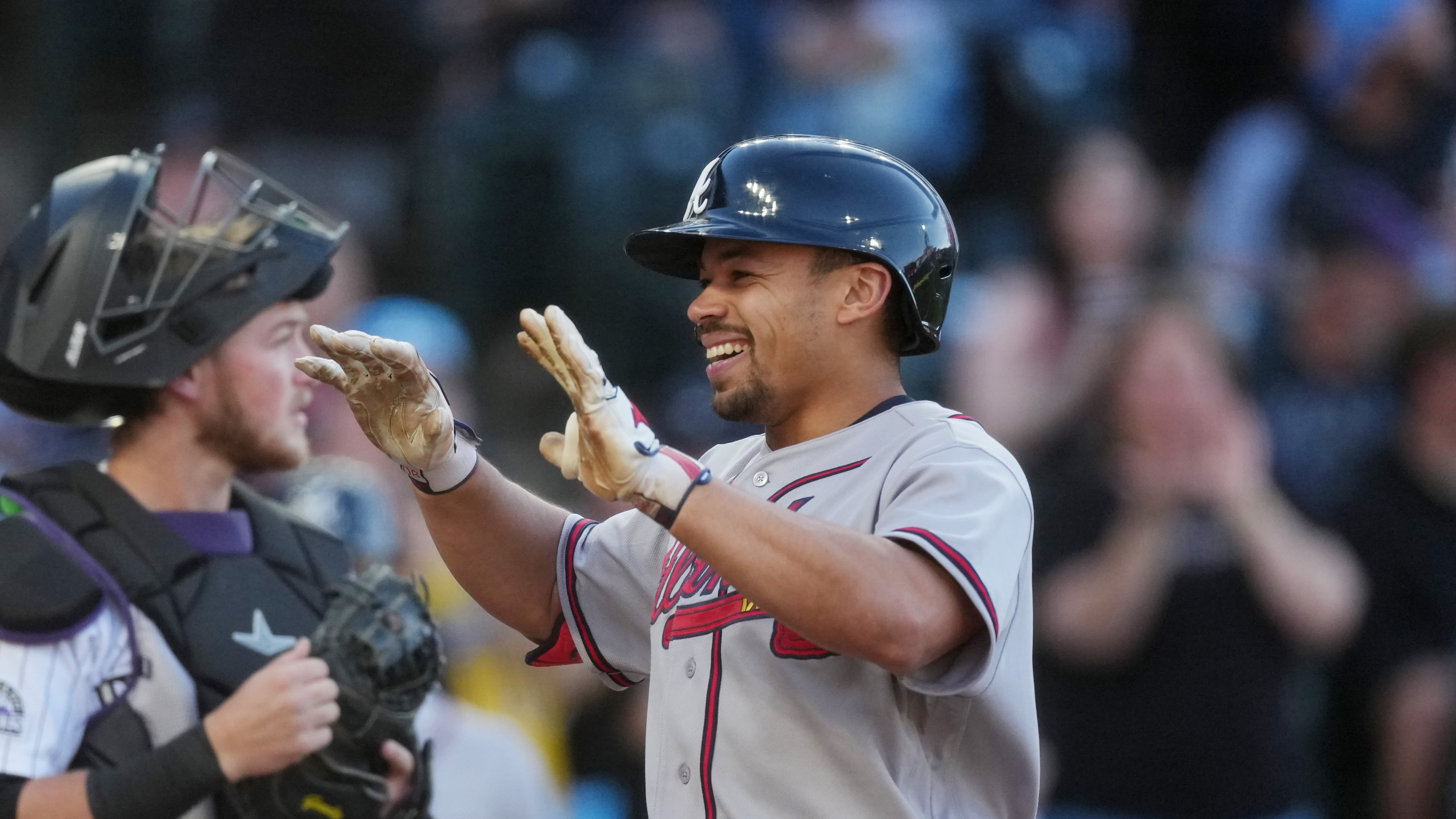 The Braves' Drake Baldwin (right) celebrates as he crosses home plate after hitting a two-run home run in the first inning Saturday, May 2, 2026, in Denver. Baldwin went 3-for-4 with four RBIs, a walk and a run. (David Zalubowski/AP)