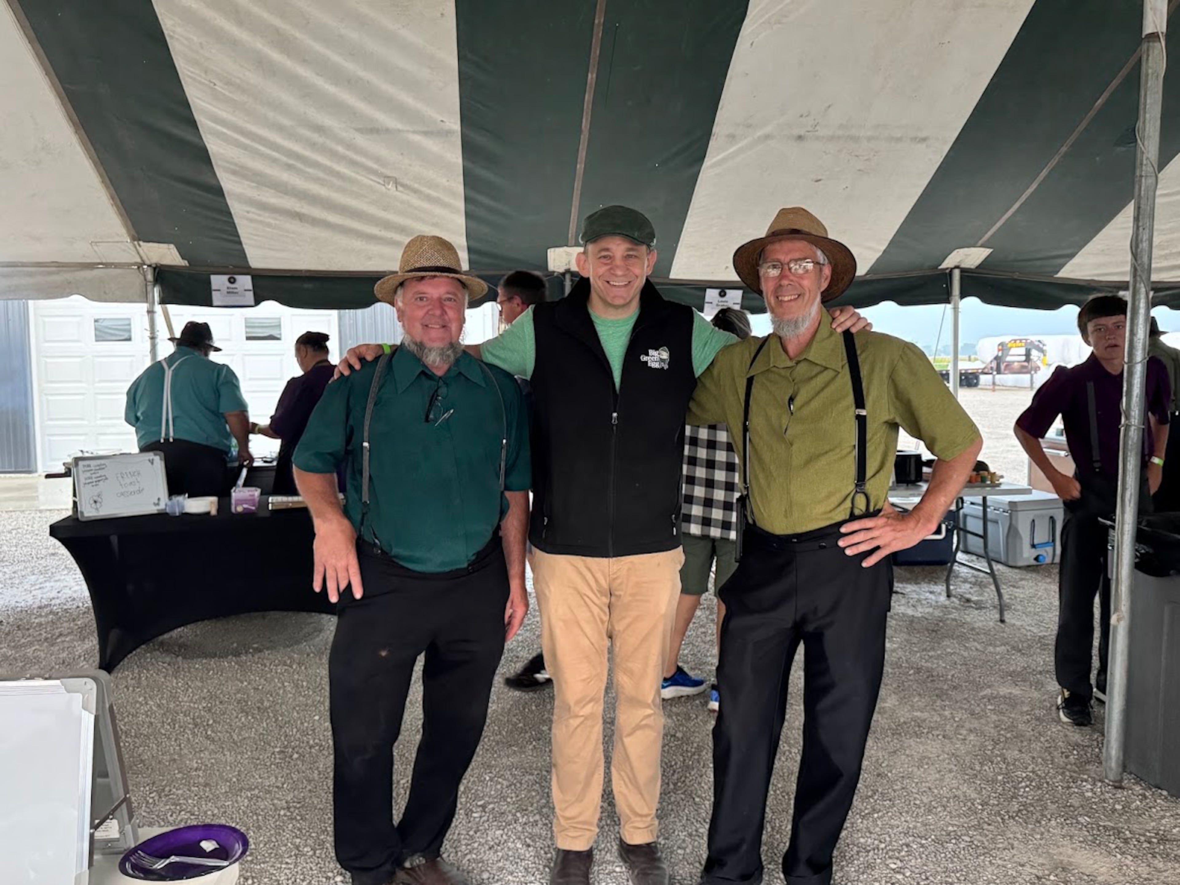 From left, The BBQ Store & More co-owner Wilmer Graber, Big Green Egg CEO Dan Gertsacov, and the BBQ Store & More co-owner Sam Schmucker gather in New Haven, Indiana, during the annual Amish Country EggFest. (Courtesy of Big Green Egg)