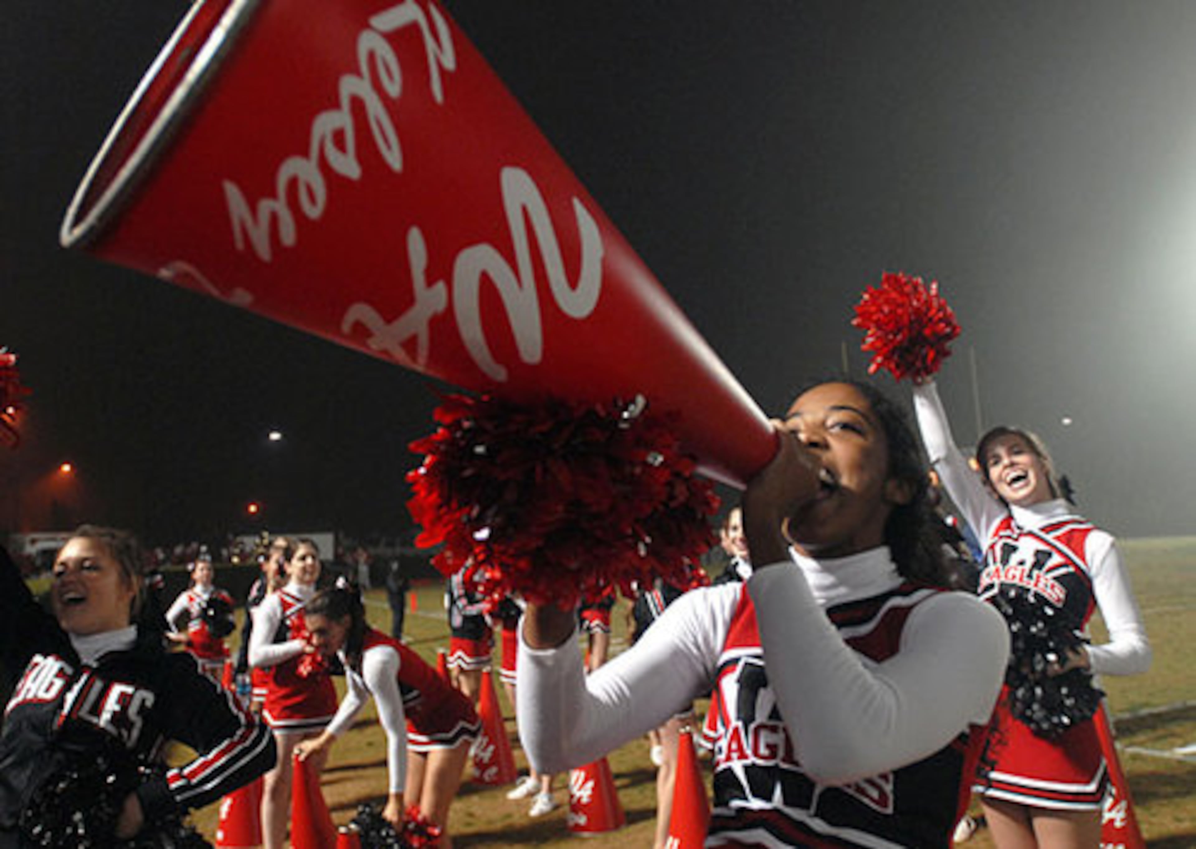 Woodward senior cheerleader Kelsey Darden makes some noise for the War Eagles.