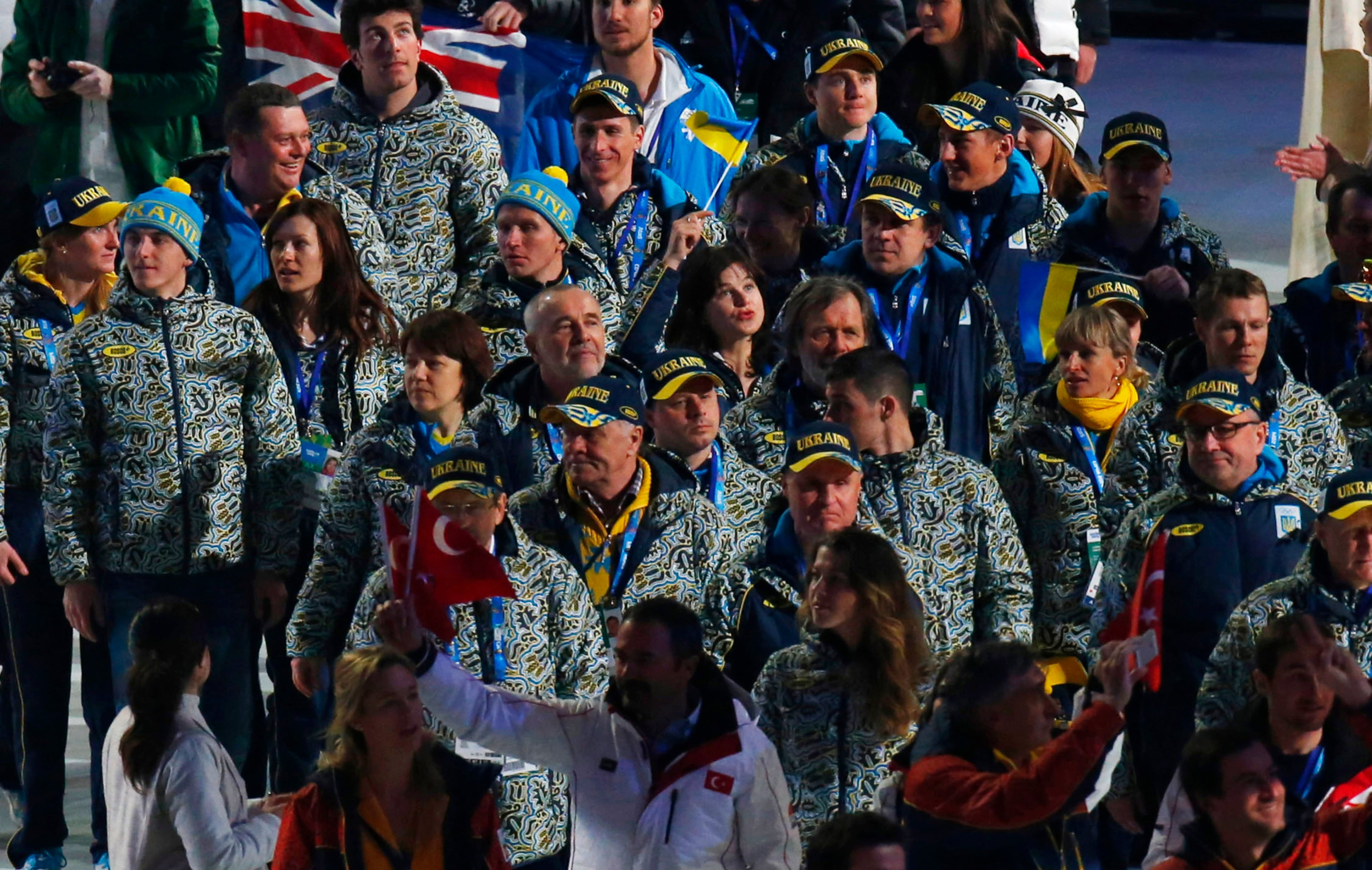 Ukrainian athletes and officials enter the arena during the closing ceremony of the 2014 Winter Olympics, Sunday, Feb. 23, 2014, in Sochi, Russia. (AP Photo/Dmitry Lovetsky)