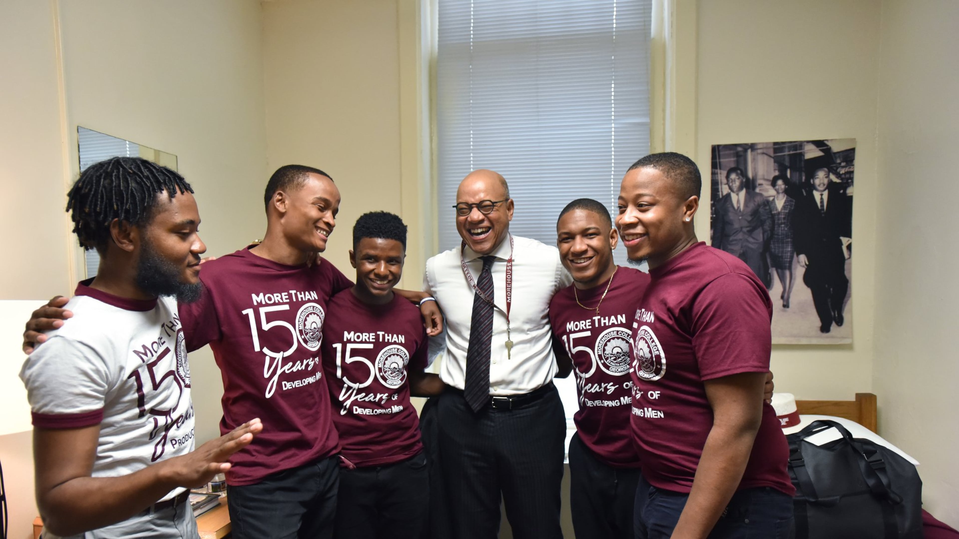 Morehouse President David A. Thomas shares a laugh with Wendell Shelby-Wallace (left), VP of the Student Government Association, and RAs (from second from left) Marcus Washington, MarKuan Tigney Jr., David Jeffries and Kayden Molock after he moved into his room at historic Graves Hall in Morehouse College on Aug. 7. HYOSUB SHIN / HSHIN@AJC.COM