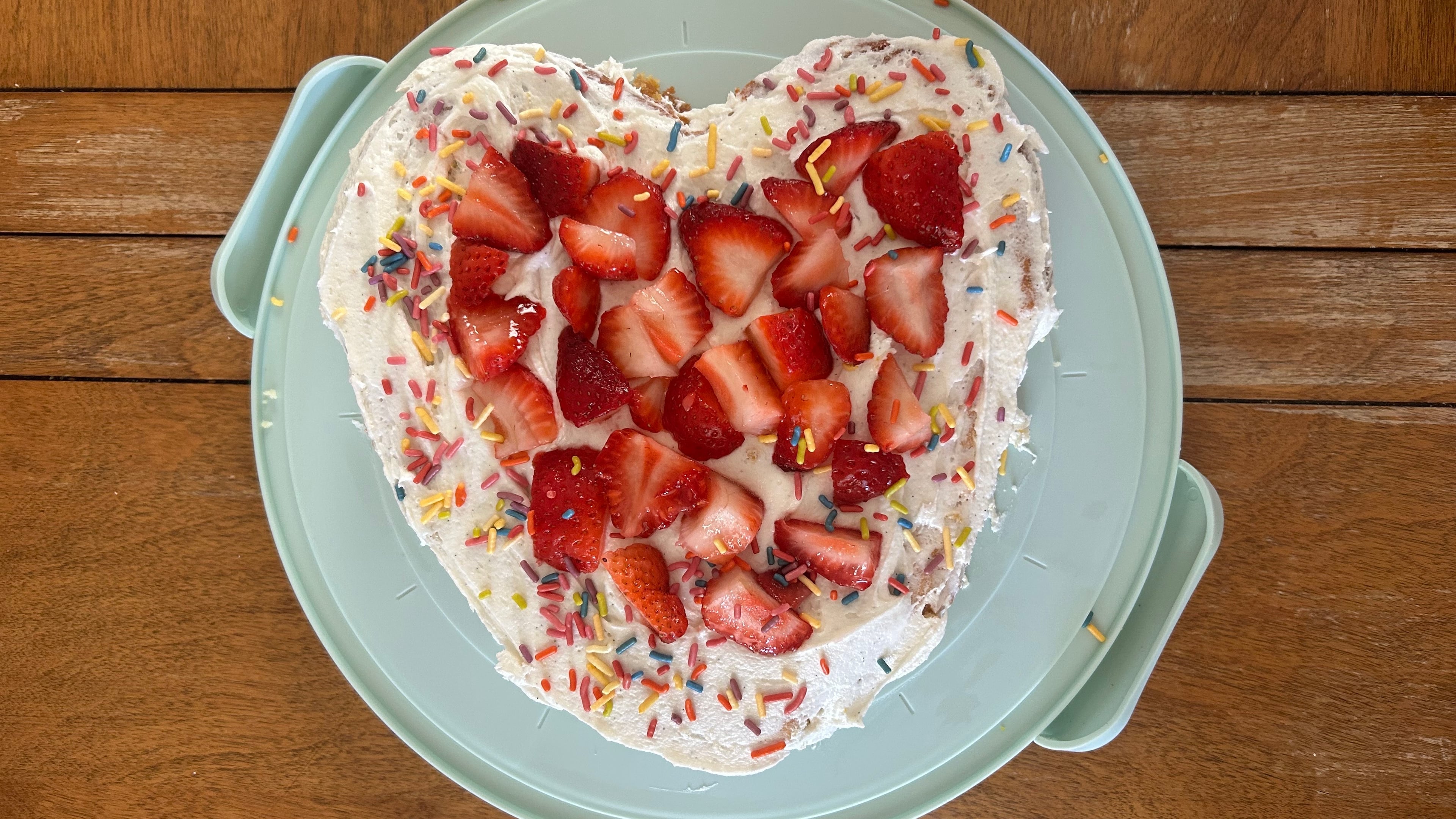 While it certainly isn't as pretty as Demi Lovato's version, strawberries and icing help hide some of my cake baking mistakes. (Olivia Wakim/AJC)