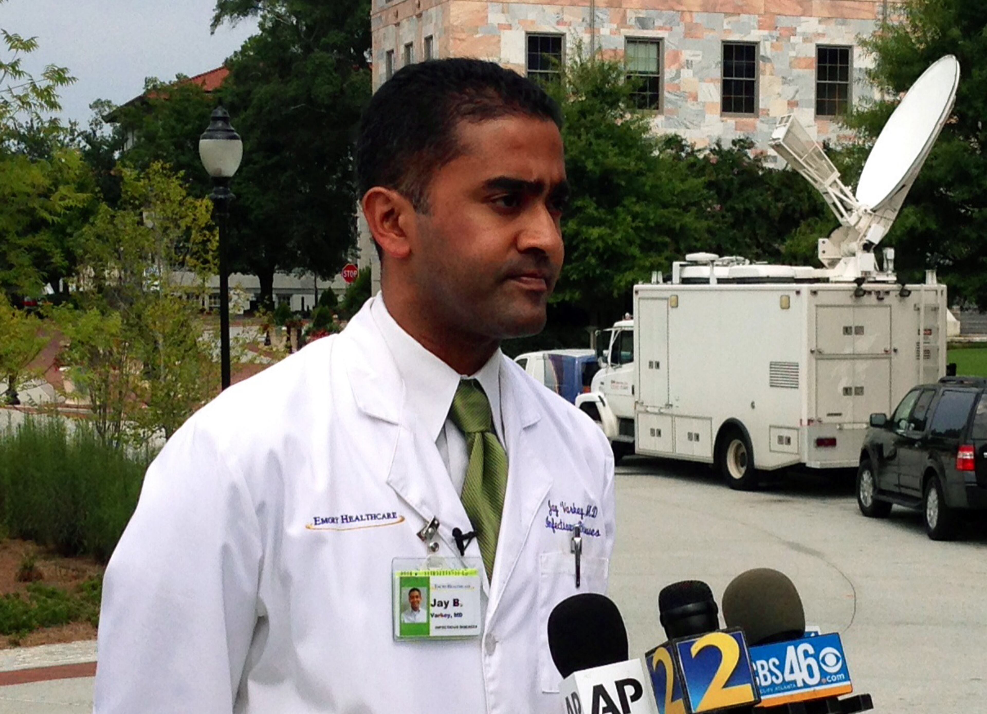 Dr. Jay Varkey, an infectious disease specialist at Emory Healthcare, speaks with reporters, Saturday, Aug. 2, 2014 in Atlanta. Varkey is part of a team of doctors who will treat the two American aid workers infected with the Ebola virus. The workers will be treated at Emory University Hospital in Atlanta. (AP Photo/Alex Sanz)