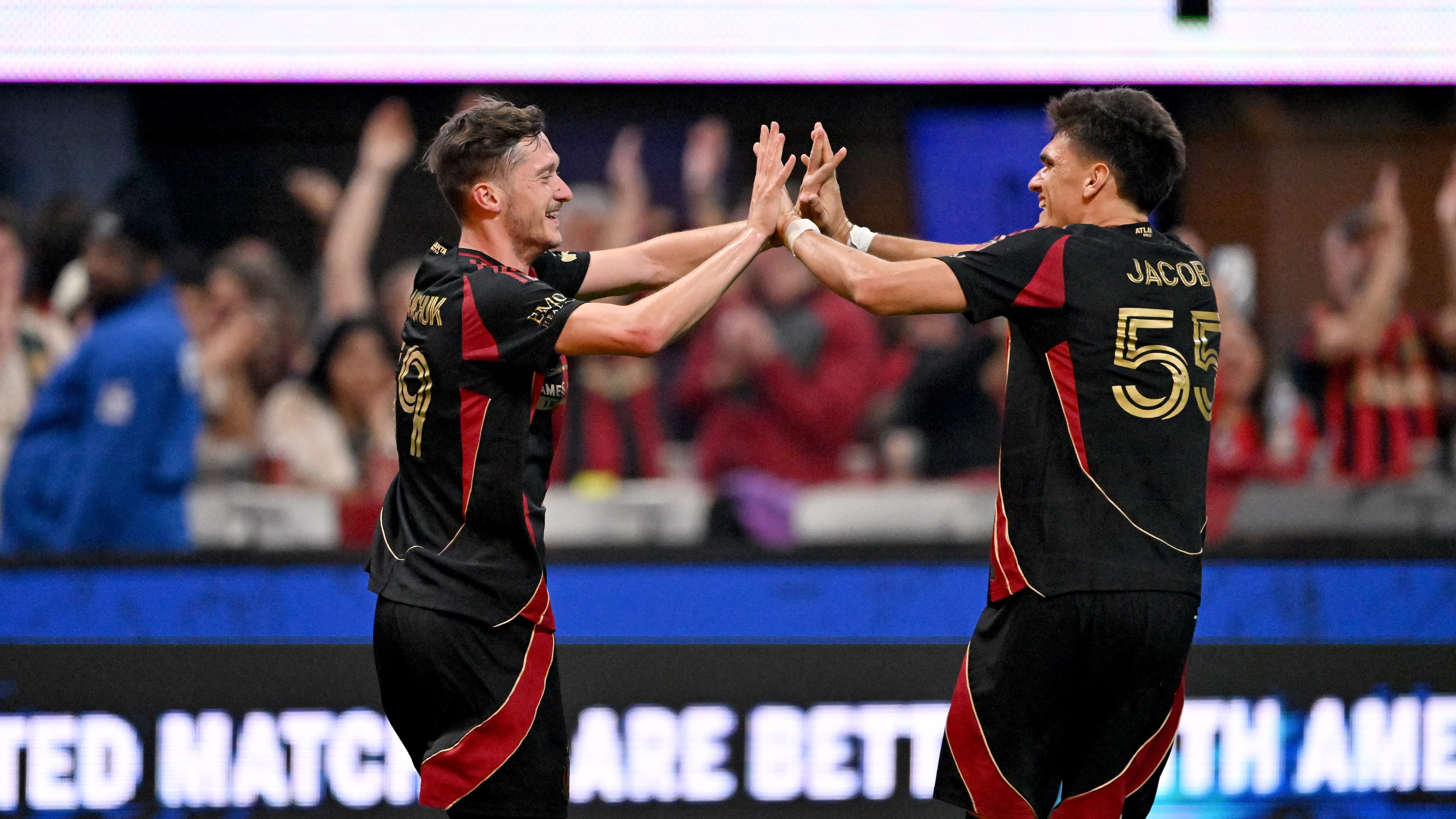 Atlanta United midfielder Aleksey Miranchuk (59) celebrates with Atlanta United defender Tomás Jacob (55) after scoring a goal during the second half in Atlanta United's home opener at Mercedes-Benz Stadium, Saturday, March 7, 2026, in Atlanta. Real Salt Lake won 3-2 over Atlanta United. (Hyosub Shin/AJC)