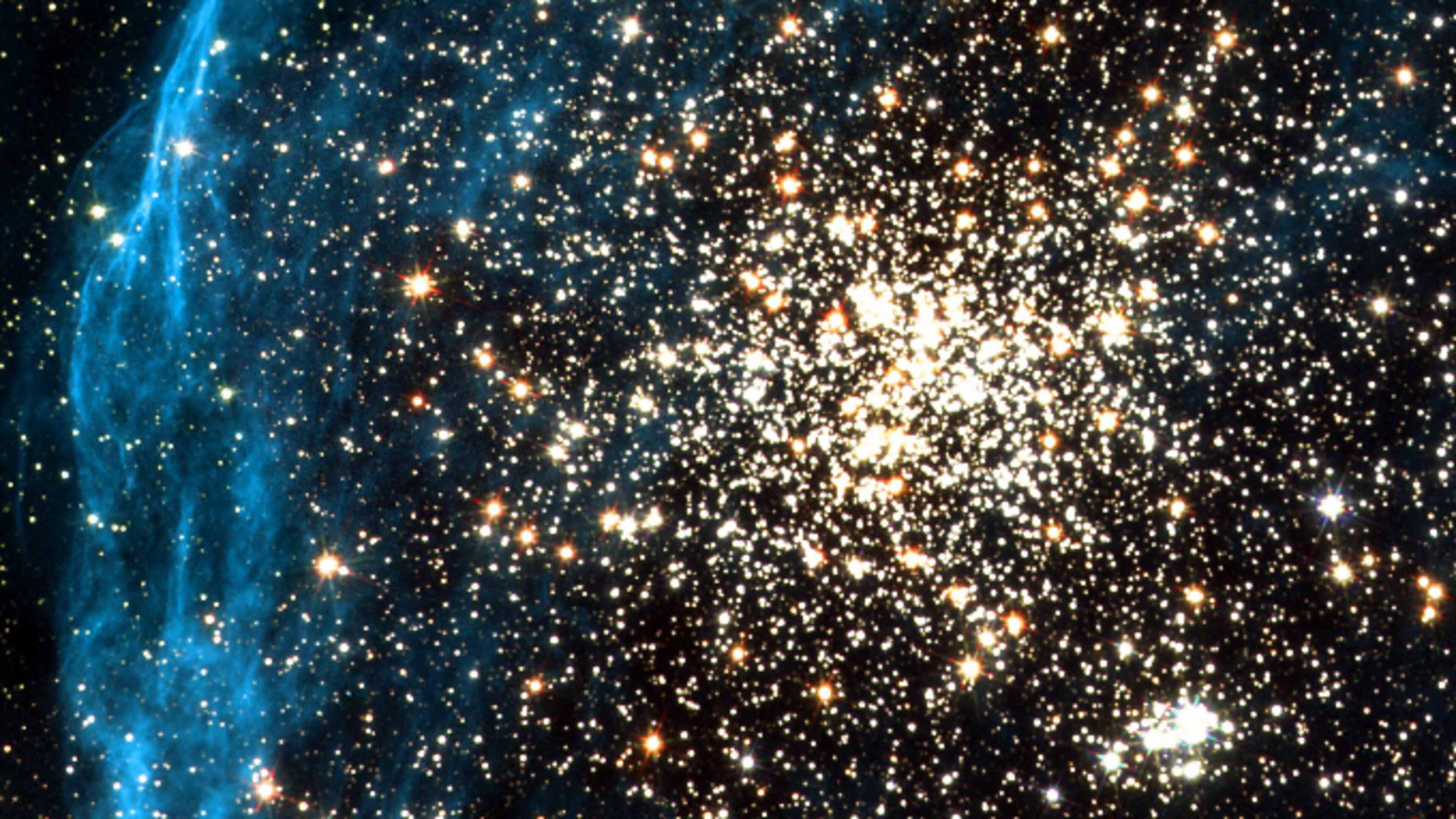 This image recorded by the Hubble telescope on July 10, 2001 shows two clusters of stars, called NGC 1850, located in a neighboring galaxy called the Large Magellanic Cloud.