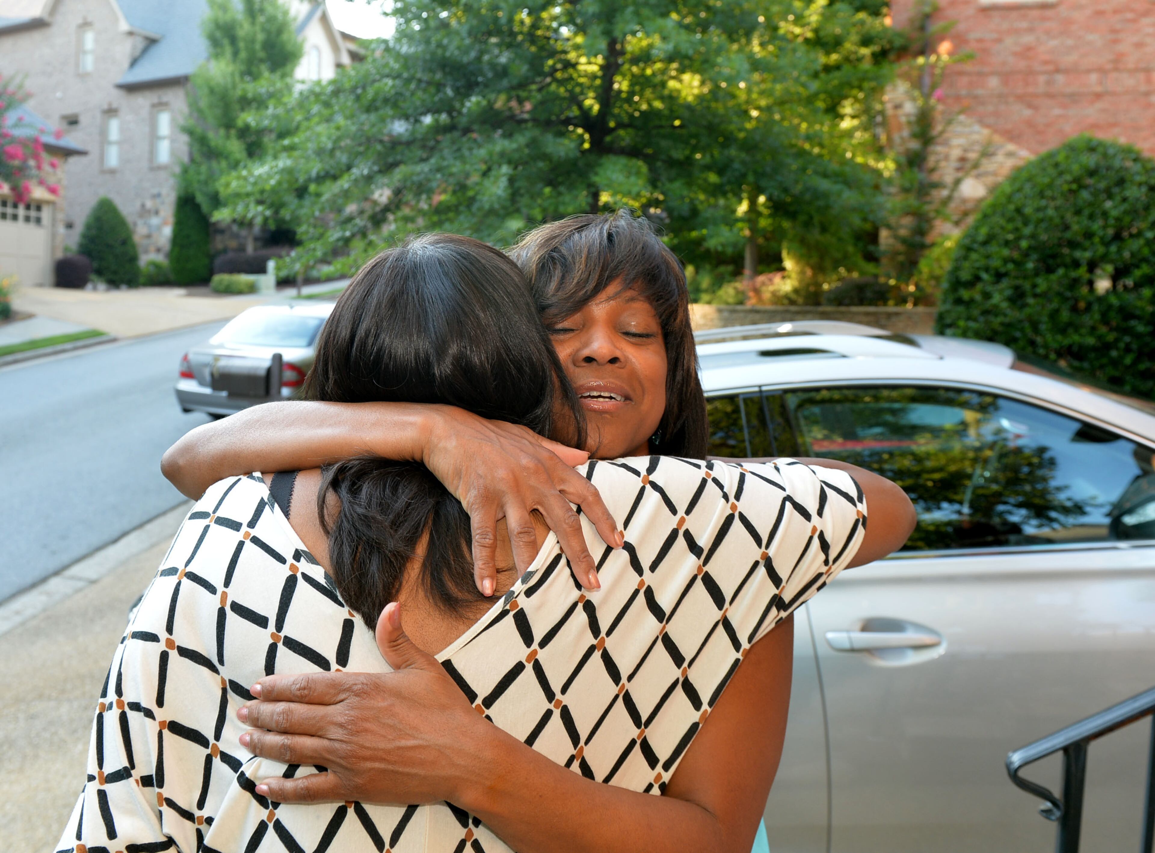 JULY 5, 2014, ATLANTA Dr. Valerie Montgomery Rice gives a hug to departing friend Wonya Lucas during a holiday gathering at her home during 4th of July weekend. Unlike most physicians who nurture childhood dreams of becoming doctors, Valerie Montgomery Rice wanted to become a chemical engineer. Then one day she looked in the mirror and realized she was "way too cute" to be an engineer. Doctoring was more suited for her out-going personality. That may have been true for a time but as it turns out academics was her true love. In September Rice will officially become the nations' first African-American woman to be named president of an independent medical school and the one of only three women in the country to hold that position. KENT D. JOHNSON/KDJOHNSON@AJC.COM
