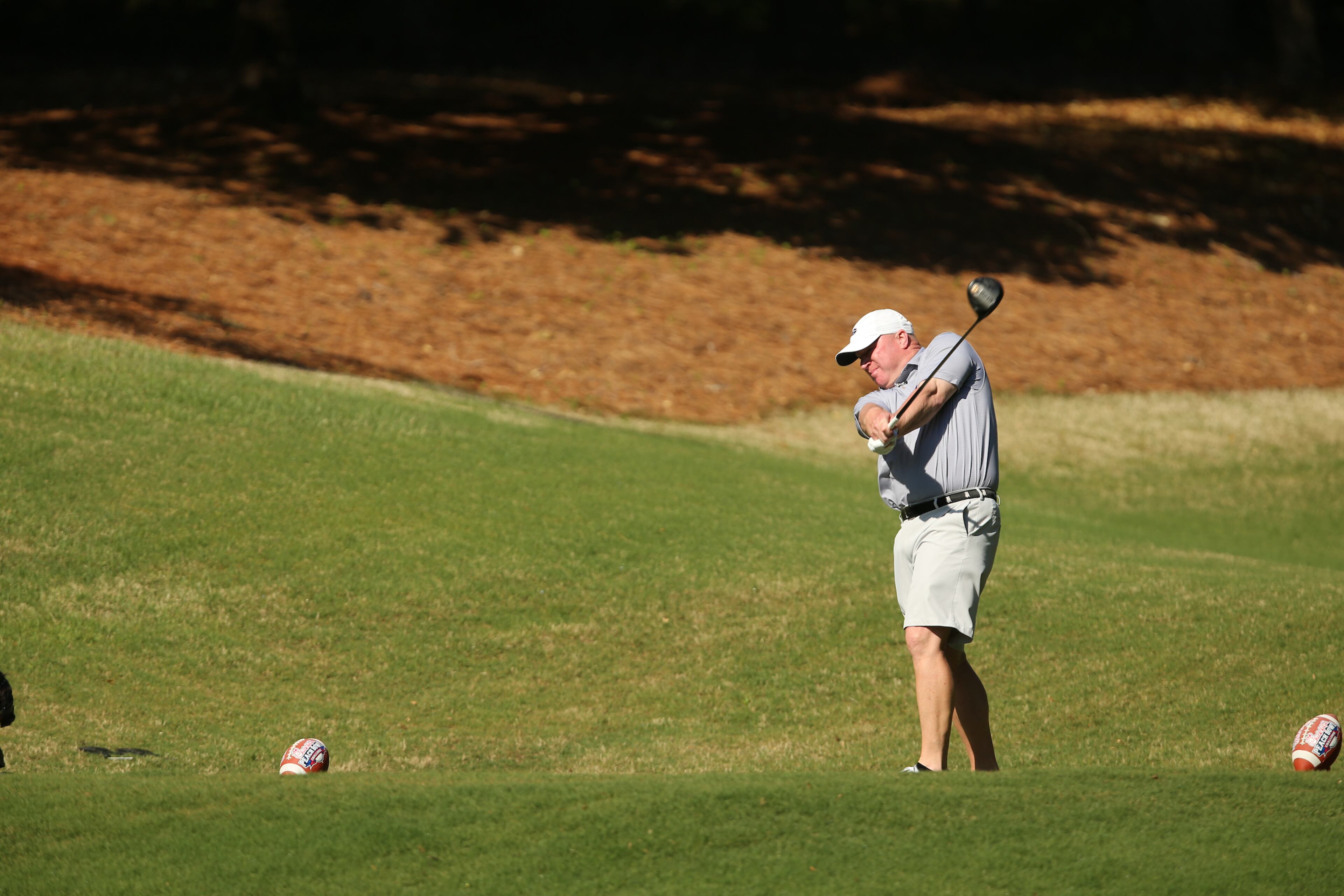 Former Georgia quarterback David Dukes tees off during the Chick-fil-A Peach Bowl Challenge at the Ritz Carlton Reynolds, Lake Oconee, on Tuesday, April 30, 2019, in Greensboro, GA. (Chris Collins via Abell Images for Chick-fil-A Peach Bowl Challenge)
