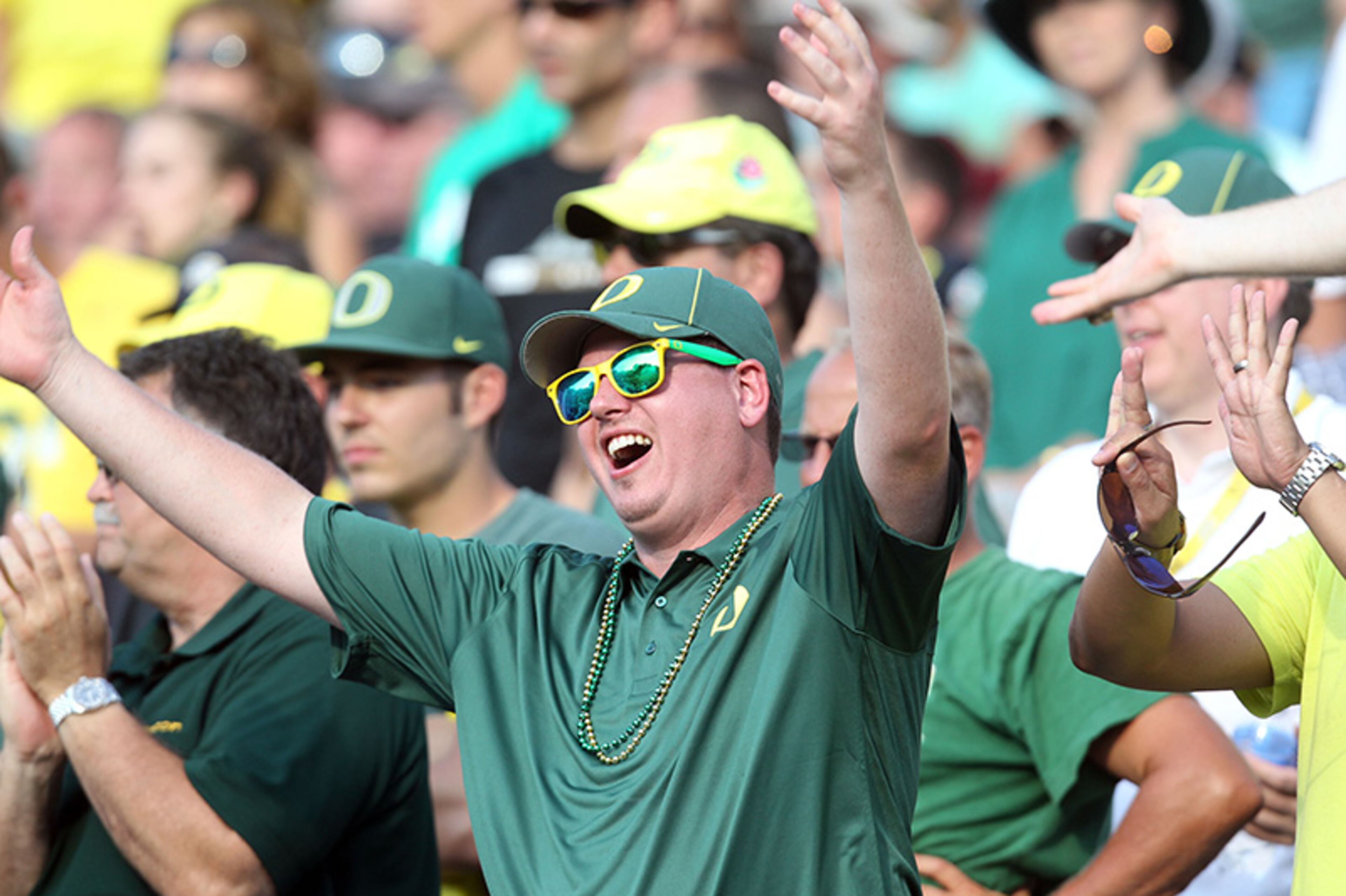 An Oregon fan reacts to a call during an NCAA college football game against Virginia, Saturday, Sept. 7, 2013, in Charlottesville, Va. Oregon defeated Virginia 59-10.