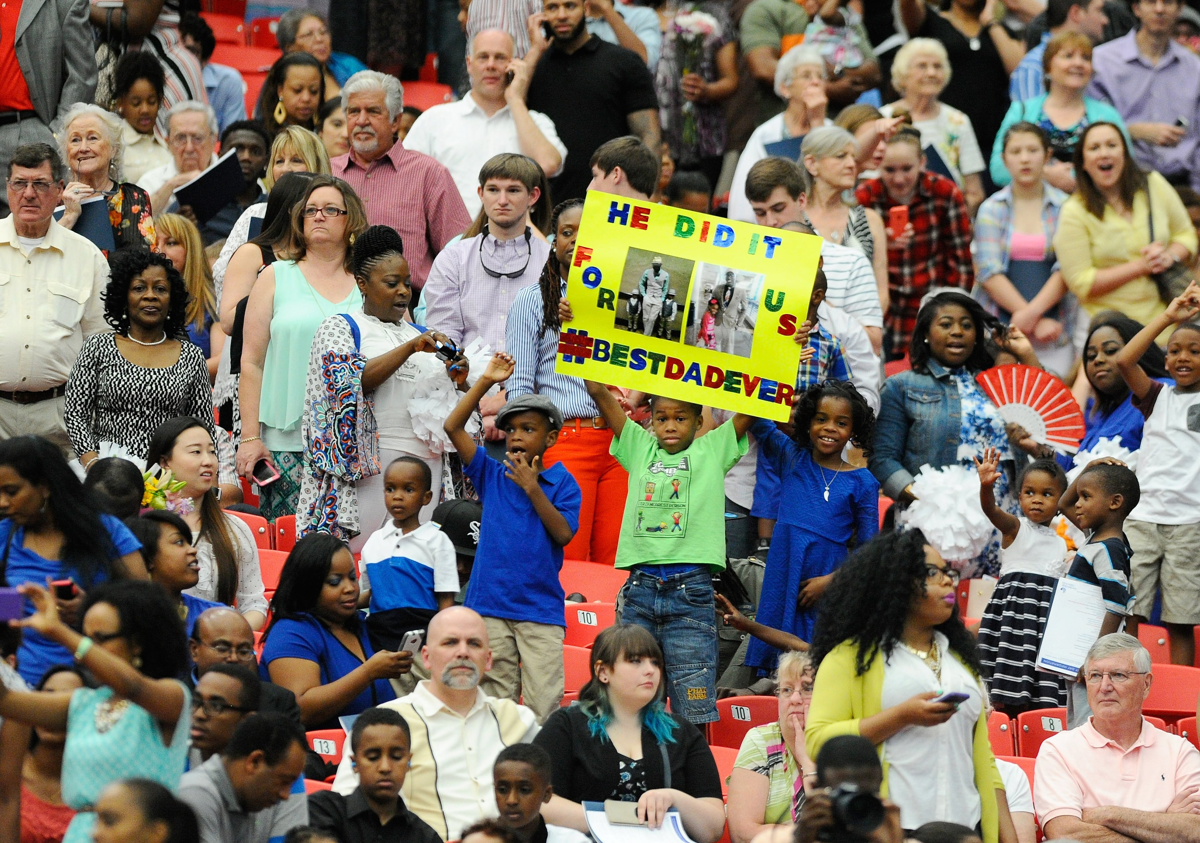 Family and friends recognize some of the more than 5,700 Georgia State University students in the college's graduation ceremony at the Georgia Dome on Saturday, May 9, 2015, in Atlanta. David Tulis / AJC Special