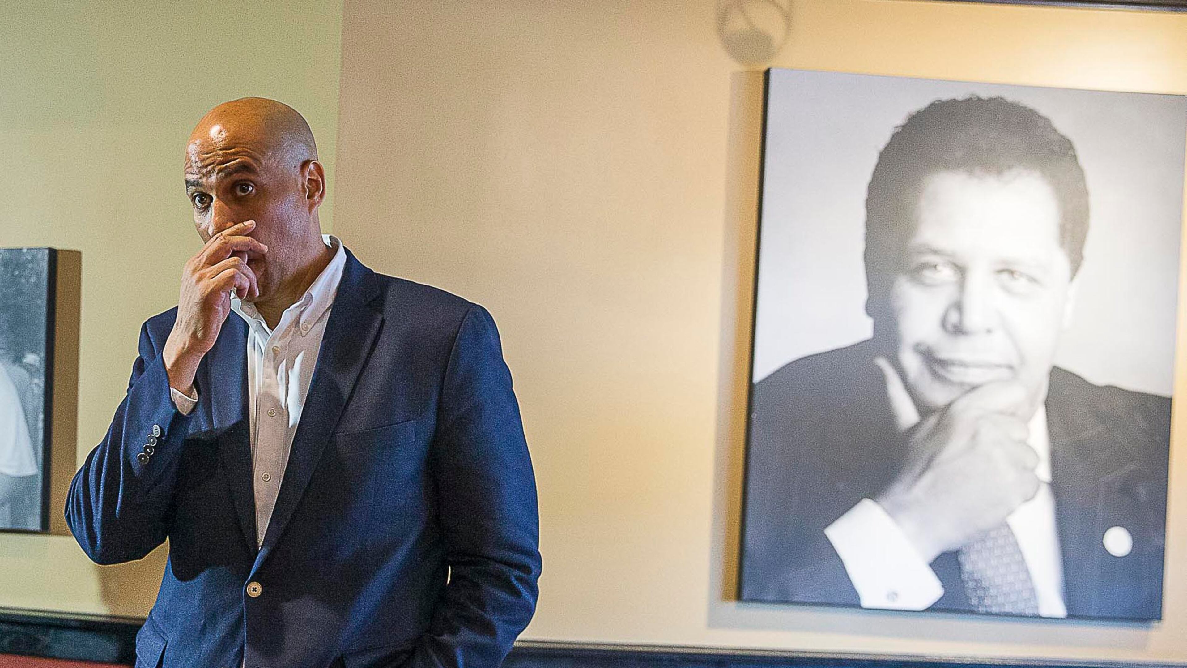 04/17/2019 -- Atlanta, Georgia -- A portrait of Atlanta's first black mayor, Maynard Jackson Jr., is displayed in the banquet room of Paschal's restaurant as U.S. Democrat Presidential hopeful Cory Booker takes a question during a campaign stop at the restaurant in Atlanta's Castleberry Hill community, Wednesday, April 17, 2019. (ALYSSA POINTER/ALYSSA.POINTER@AJC.COM)