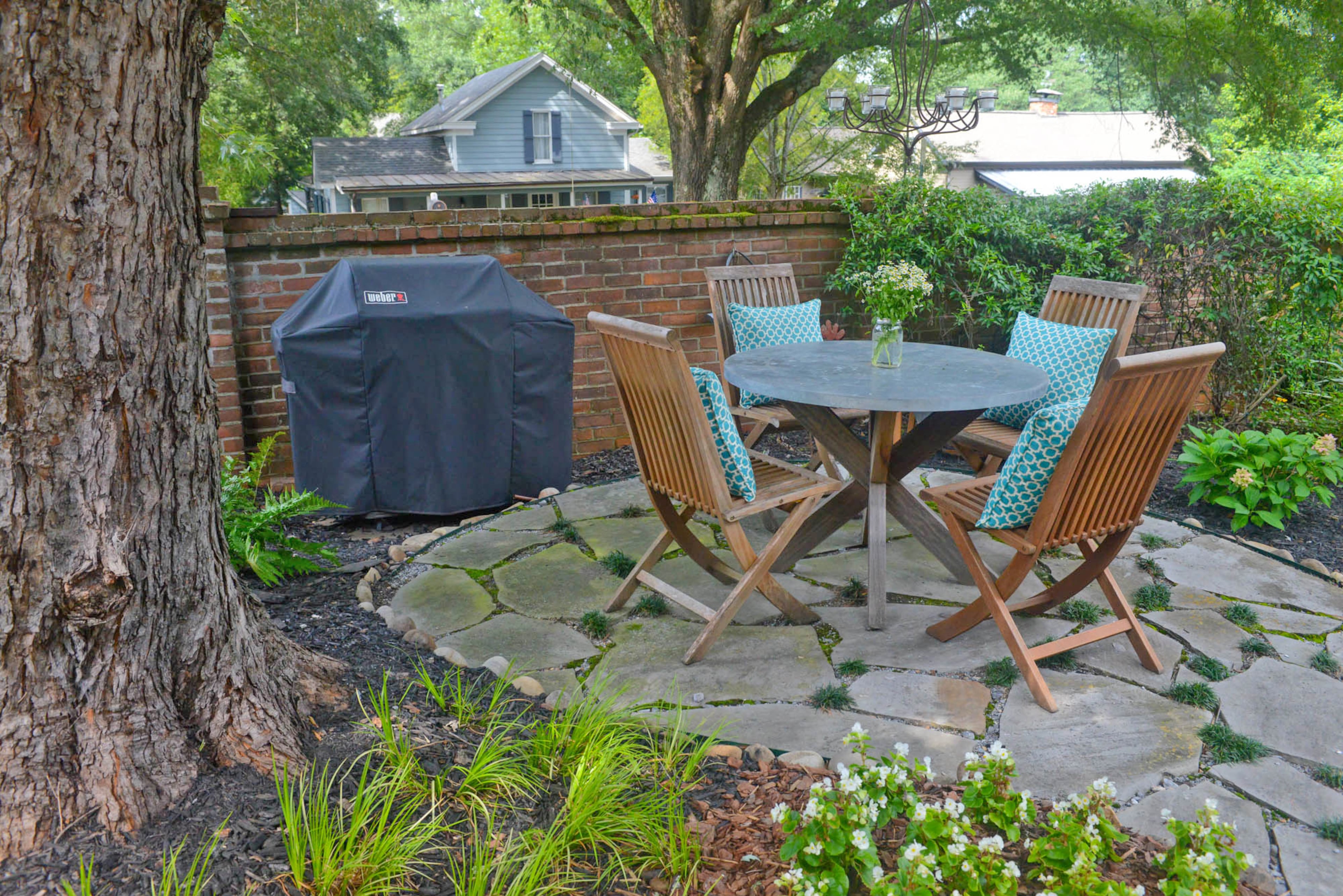The courtyard behind the home is a frequent spot for the homeowners to eat dinner, relax with a glass of wine, or entertain family and friends.