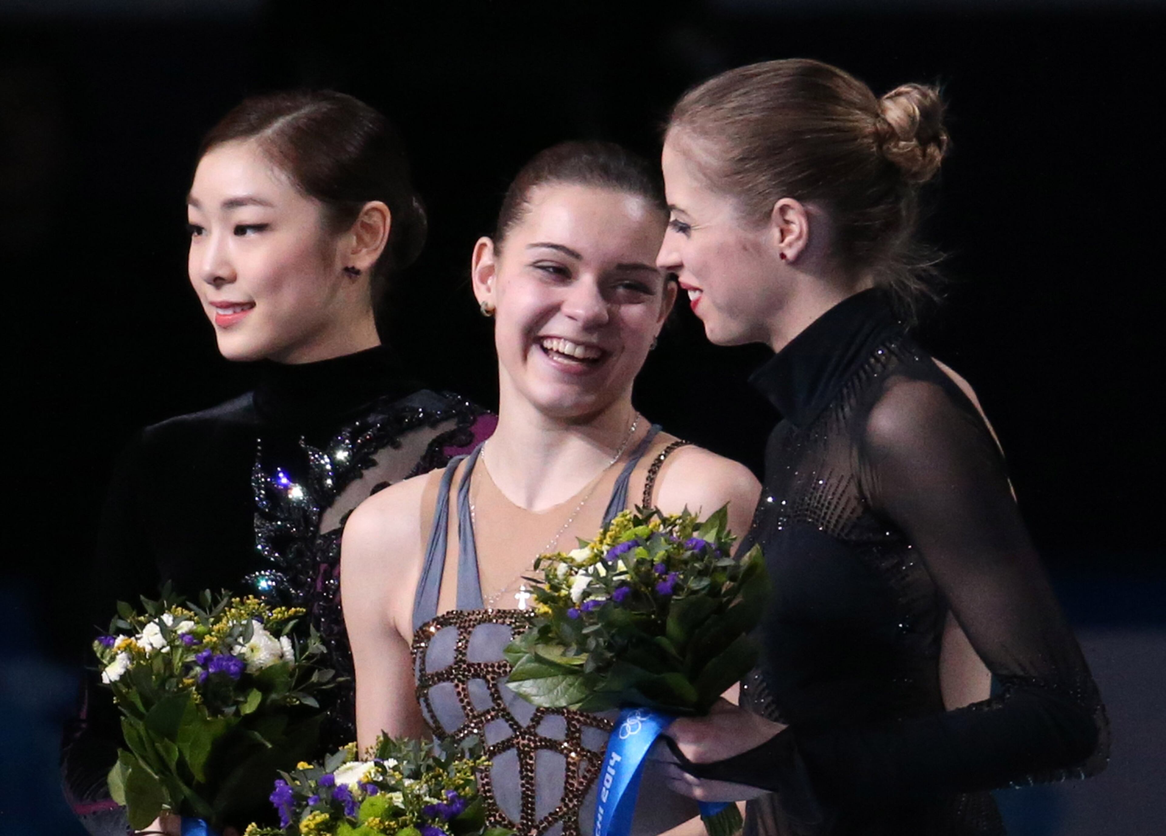 Yuna Kim of South Korea, Adelina Sotnikova of Russia and Carolina Kostner of Italy celebrate after ladies' figure skating at the Iceberg Skating Palace during the Winter Olympics in Sochi, Russia, Thursday, Feb. 20, 2014. (Brian Cassella/Chicago Tribune/MCT)
